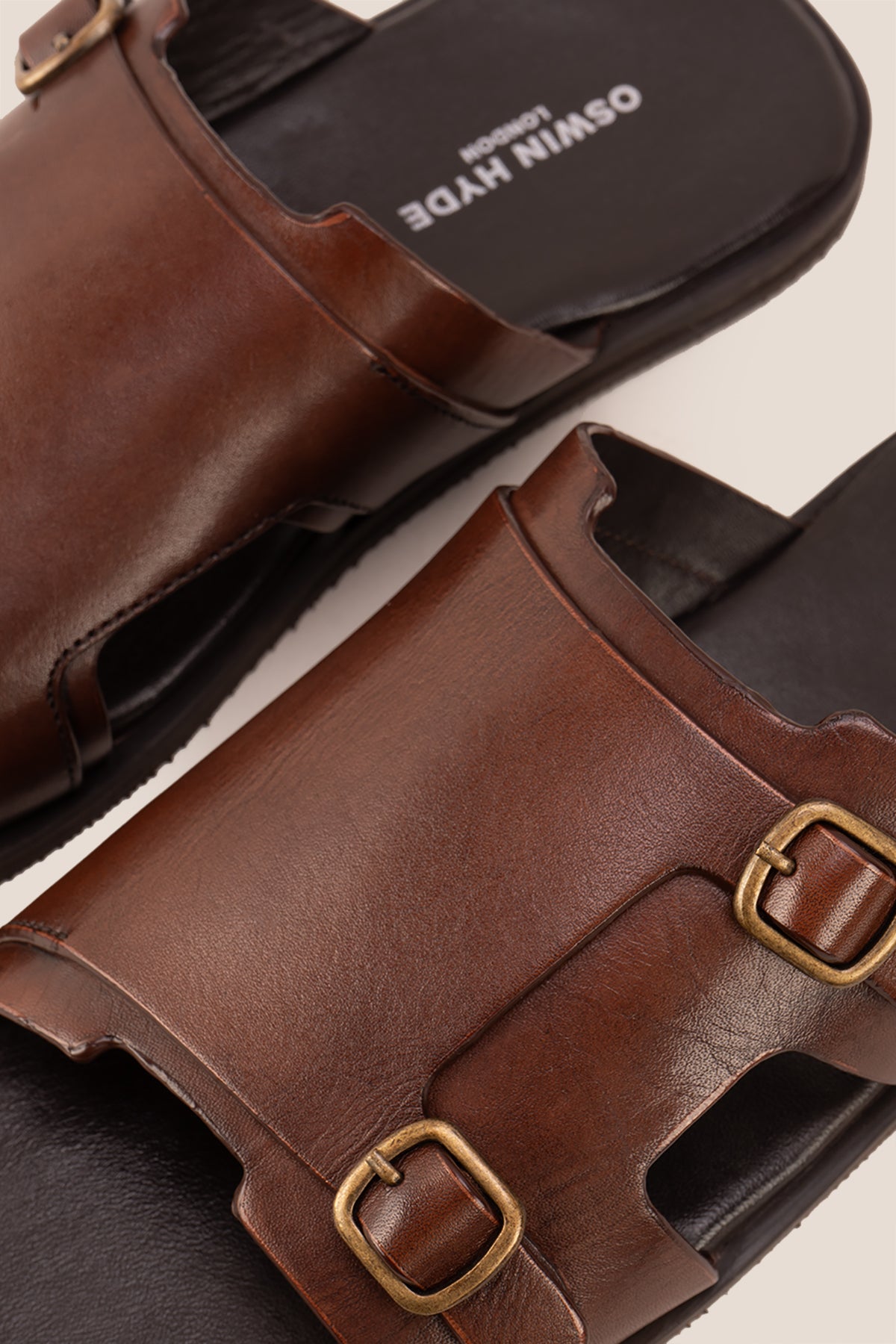 Logan Brown men’s leather sandals with premium stitching and timeless design, ideal for warm-weather comfort and smart-casual summer looks.