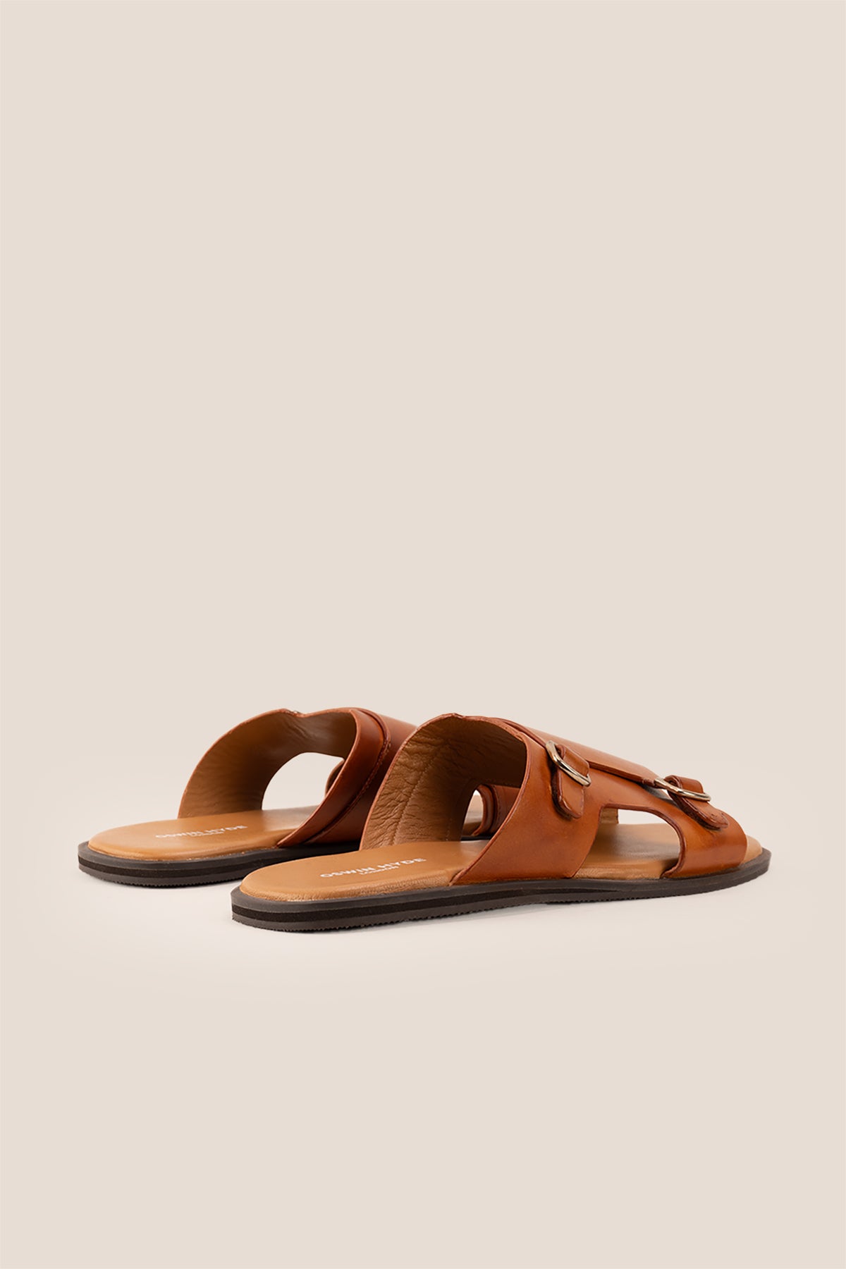 Logan tan leather sandals for men made from premium leather with open-toe design and stitched sole, ideal for summer comfort and smart-casual wear.