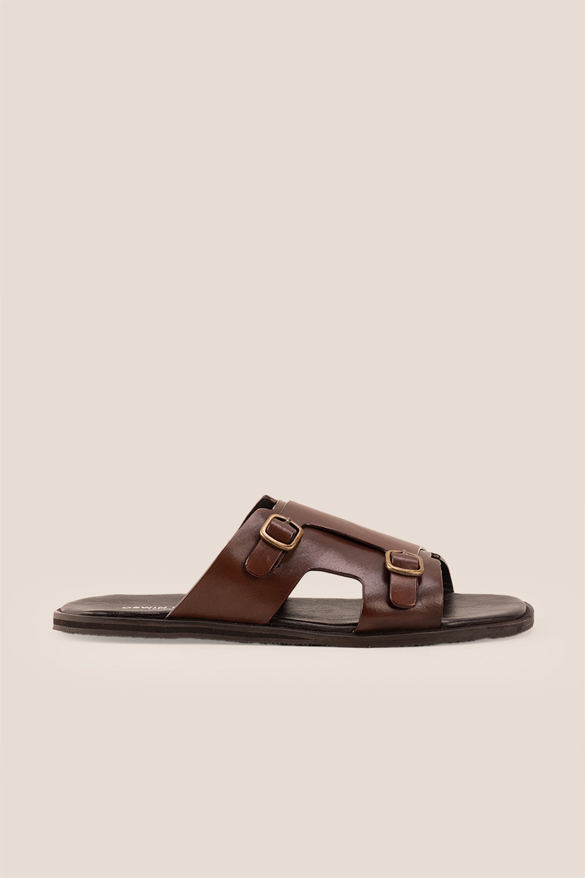 Logan Brown men’s leather sandals with premium stitching and timeless design, ideal for warm-weather comfort and smart-casual summer looks.