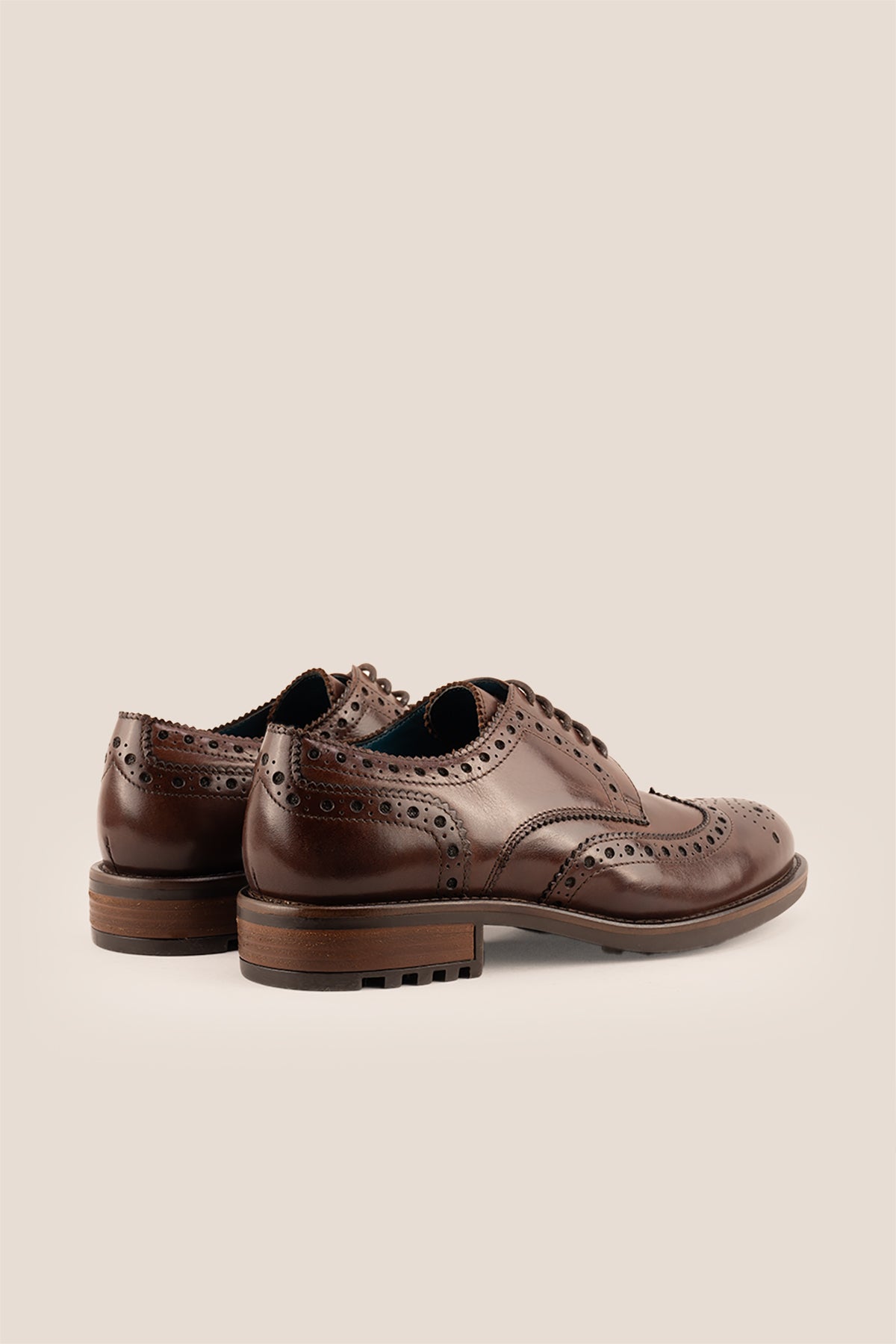 George Brown leather shoes for men. Featuring a five-eyelet wing cap brogue design, these shoes offer timeless style and comfort