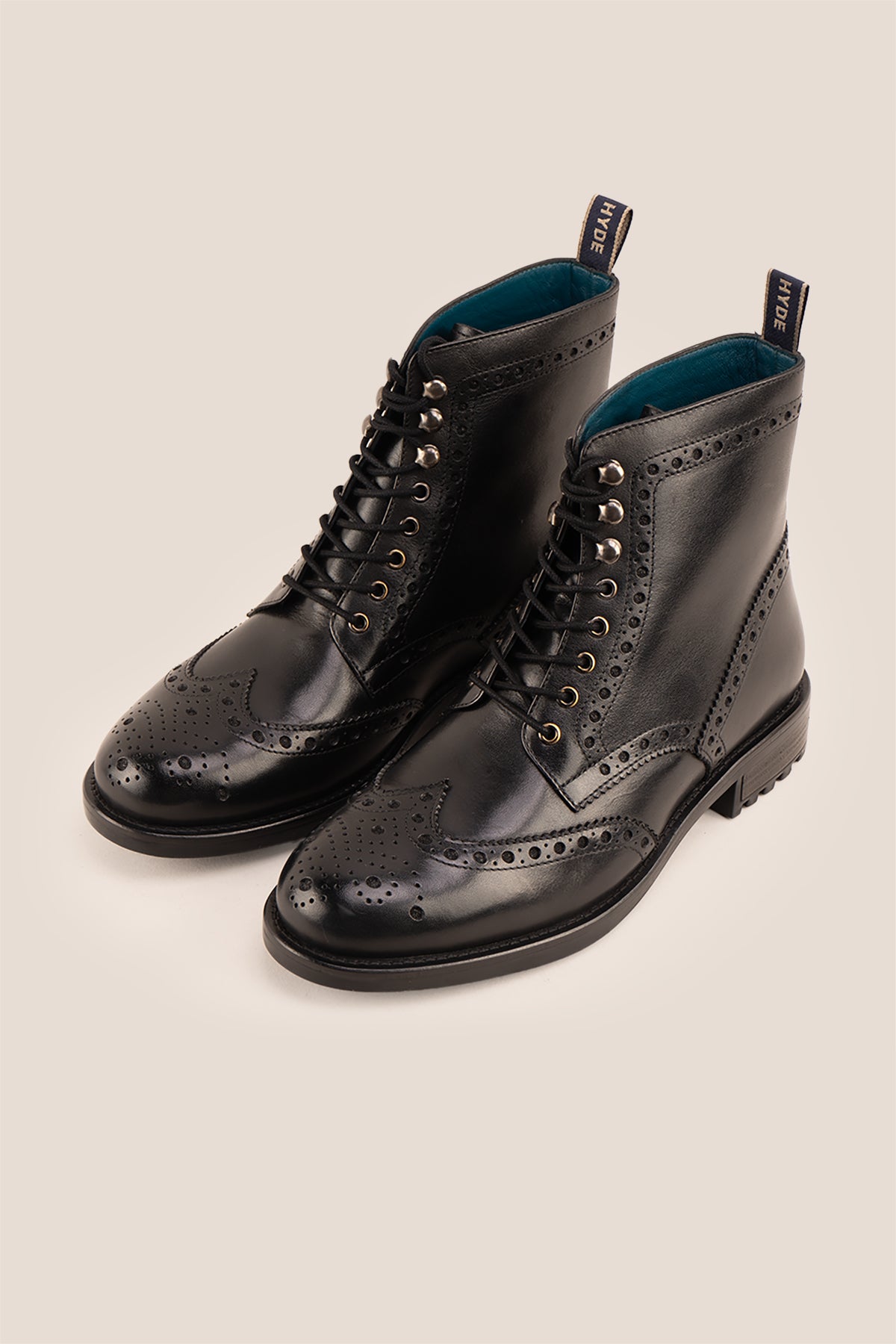 Gregory black leather lace-up boots for men featuring a classic wing cap brogue design with refined stitching and polished finish