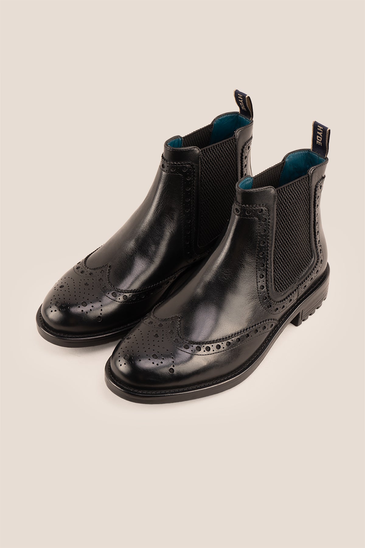 Gavin black leather Chelsea boots for men with intricate brogue detailing, showcasing timeless elegance and refined craftsmanship