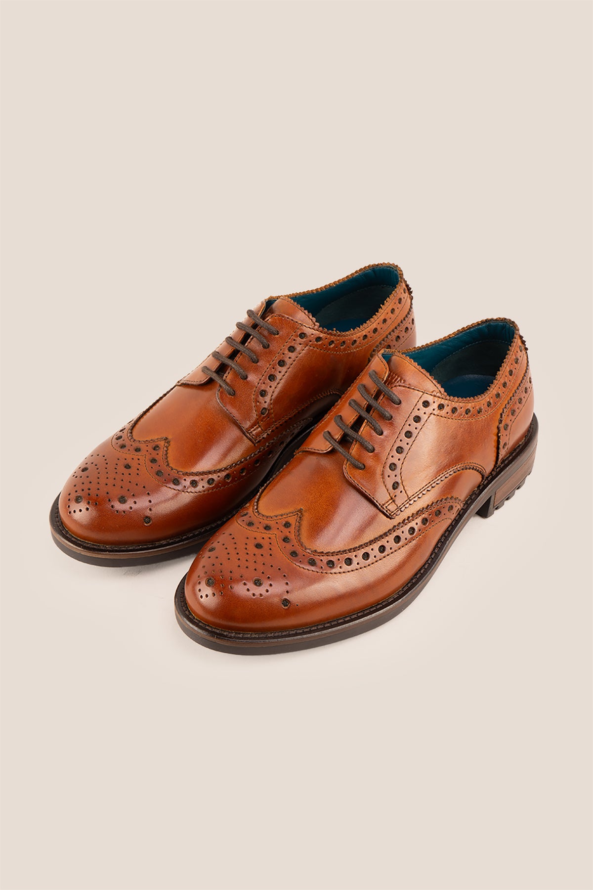 George Tan leather shoes for men. Featuring a five-eyelet wing cap brogue design, these shoes offer timeless style and comfort