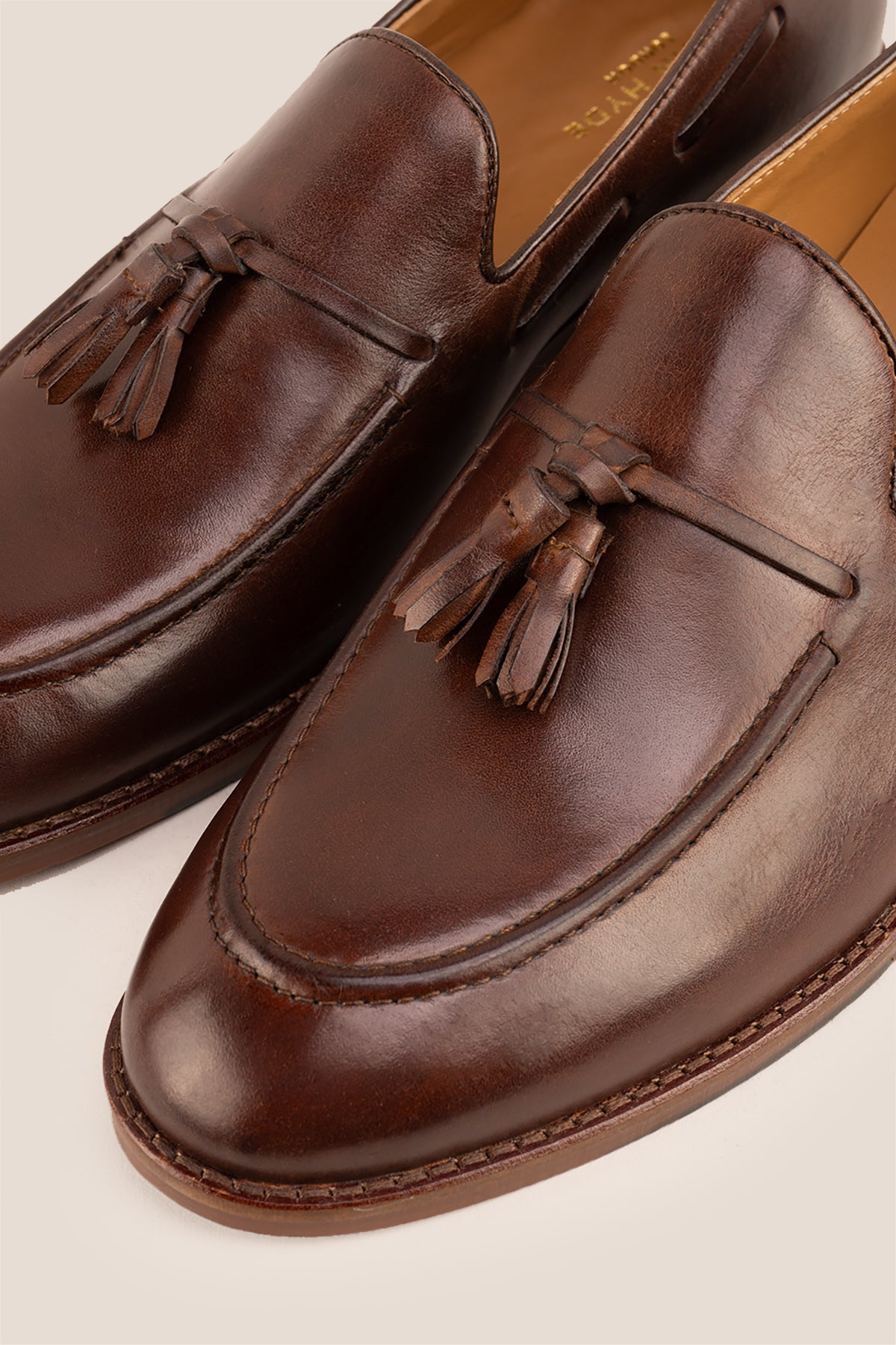 Issac Brown leather tassel loafers for men with comfort sole, stylish and supportive, perfect for modern smart-casual looks.