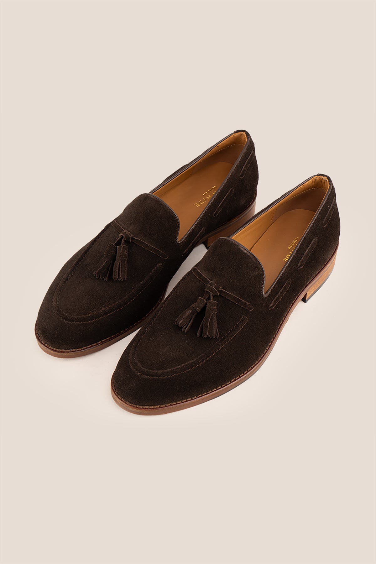 Brown suede tassel loafers for men with comfort sole, combining premium suede craftsmanship and modern elegance for stylish everyday wear.