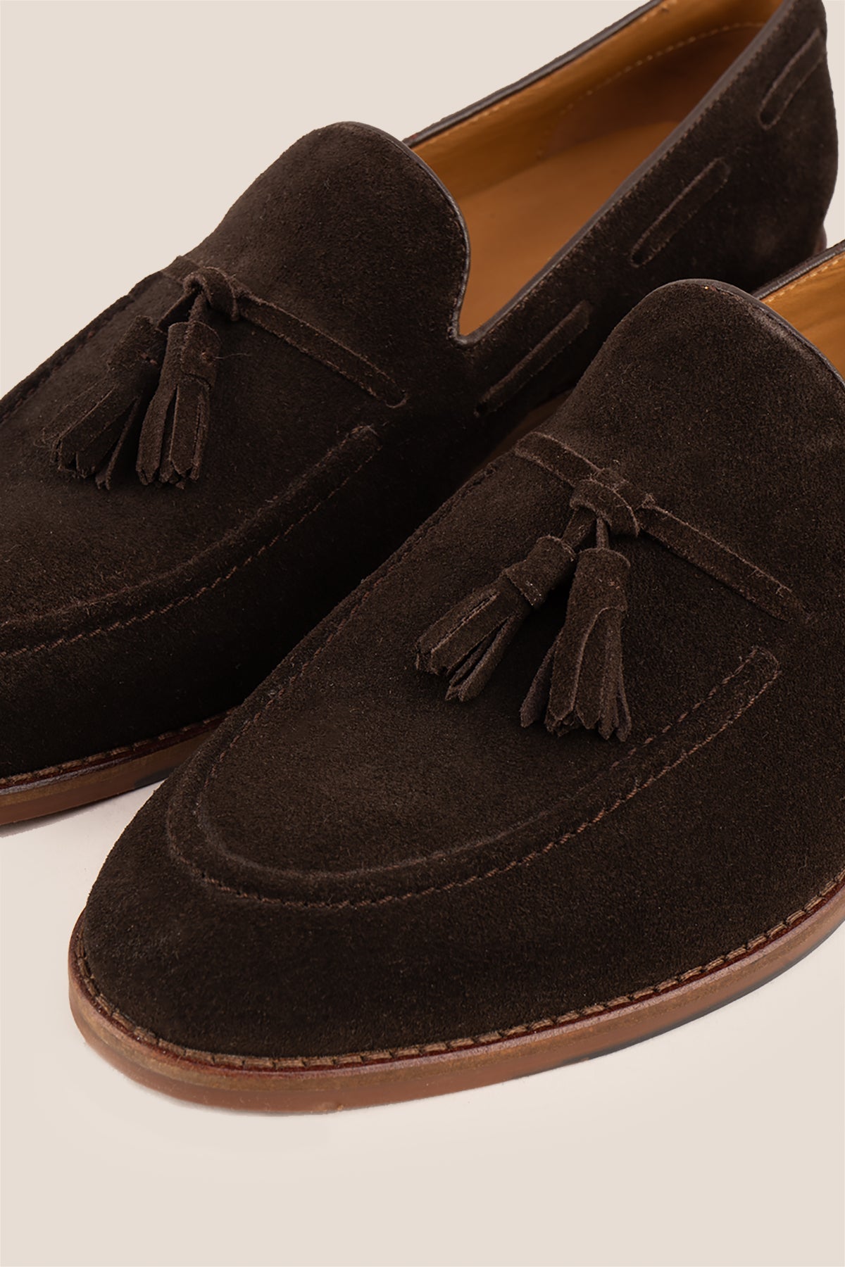 Brown suede tassel loafers for men with comfort sole, combining premium suede craftsmanship and modern elegance for stylish everyday wear.