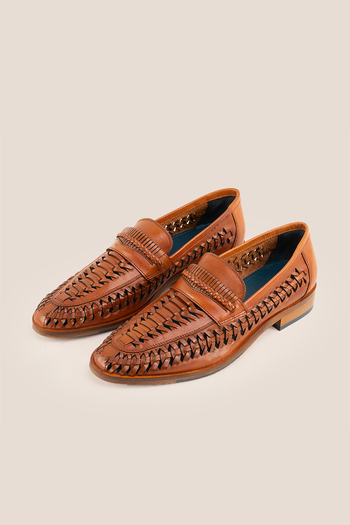 Finley tan woven leather loafer for men, showcasing premium craftsmanship with a sophisticated and timeless design
