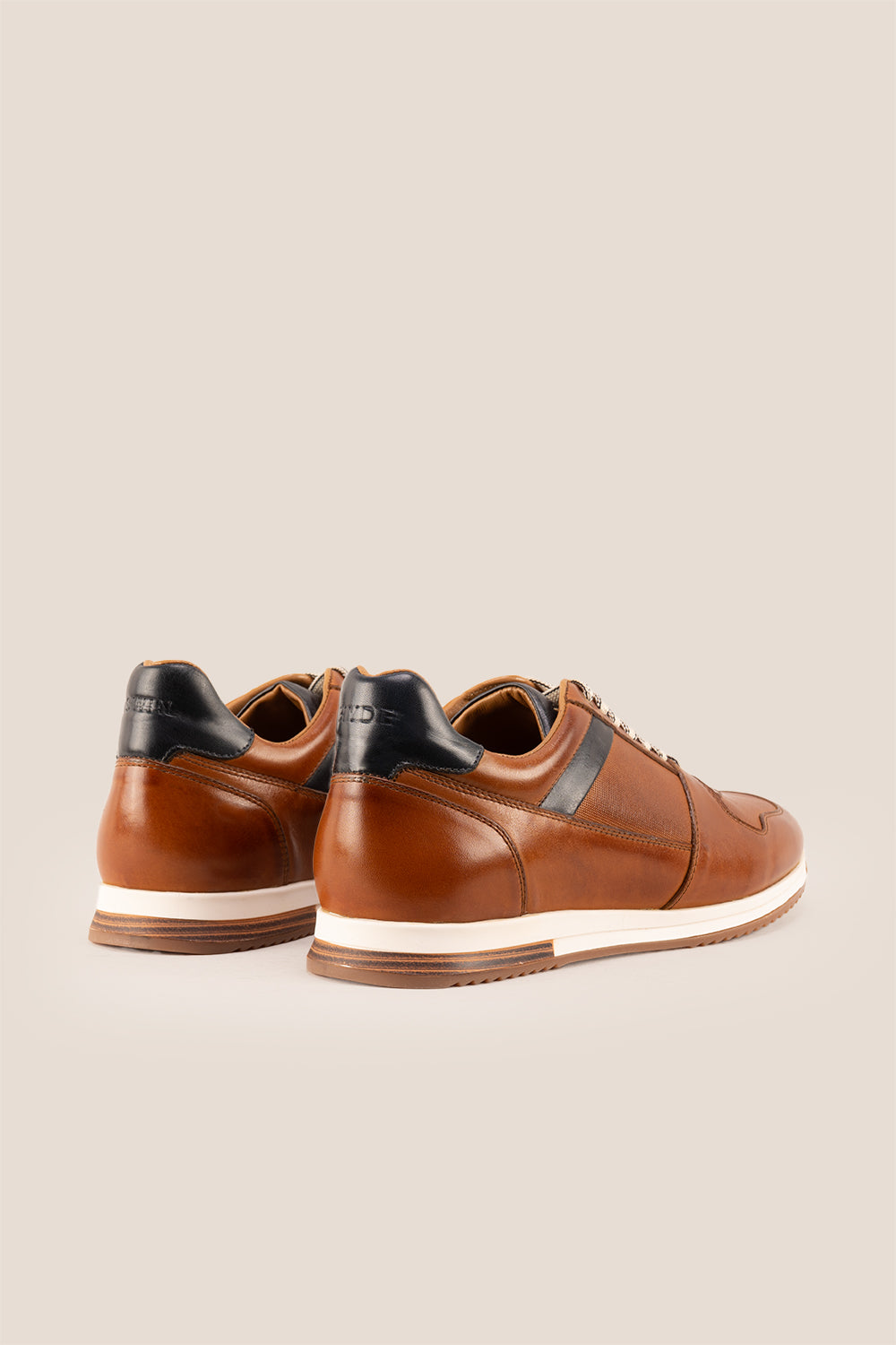 Rory Tan leather sneakers for men, featuring a classic design that exudes timeless elegance.
