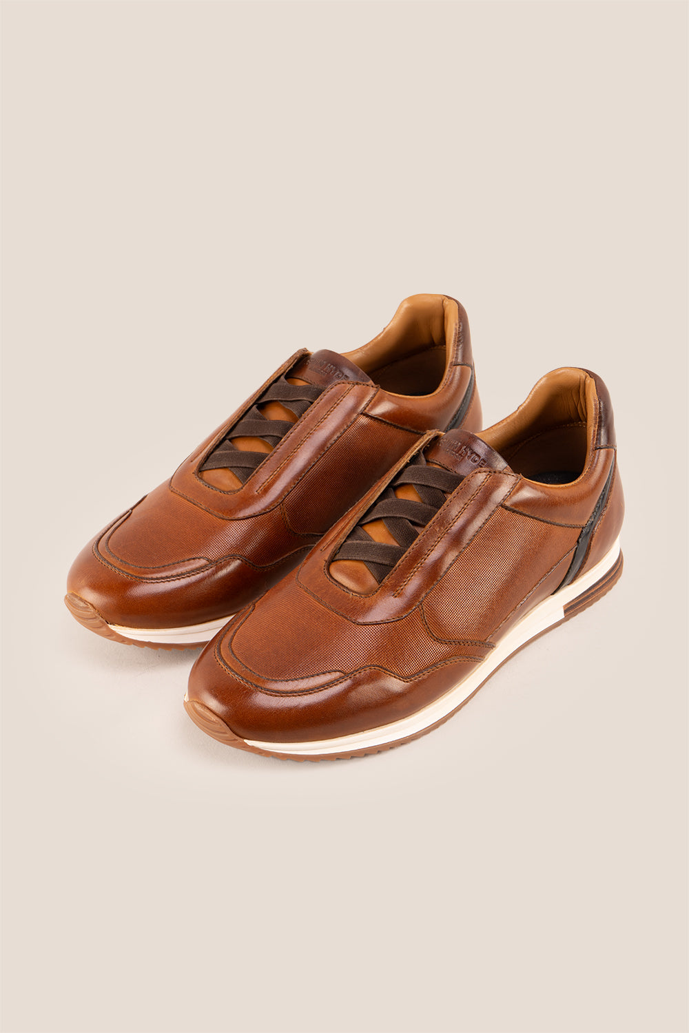 Colt tan men’s leather sneakers with elastic detailing for a secure, comfortable fit and modern casual style