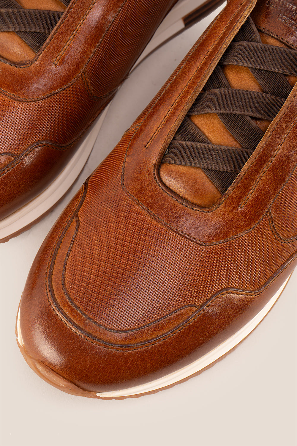 Colt tan men’s leather sneakers with elastic detailing for a secure, comfortable fit and modern casual style