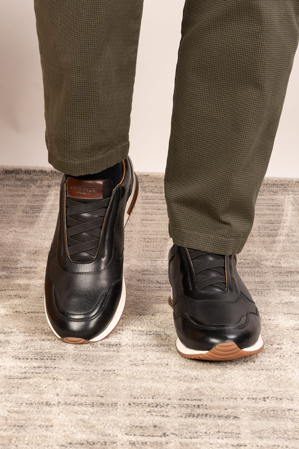 Colt black men's leather sneakers with elastic detailing for a secure, comfortable fit and sleek, modern style