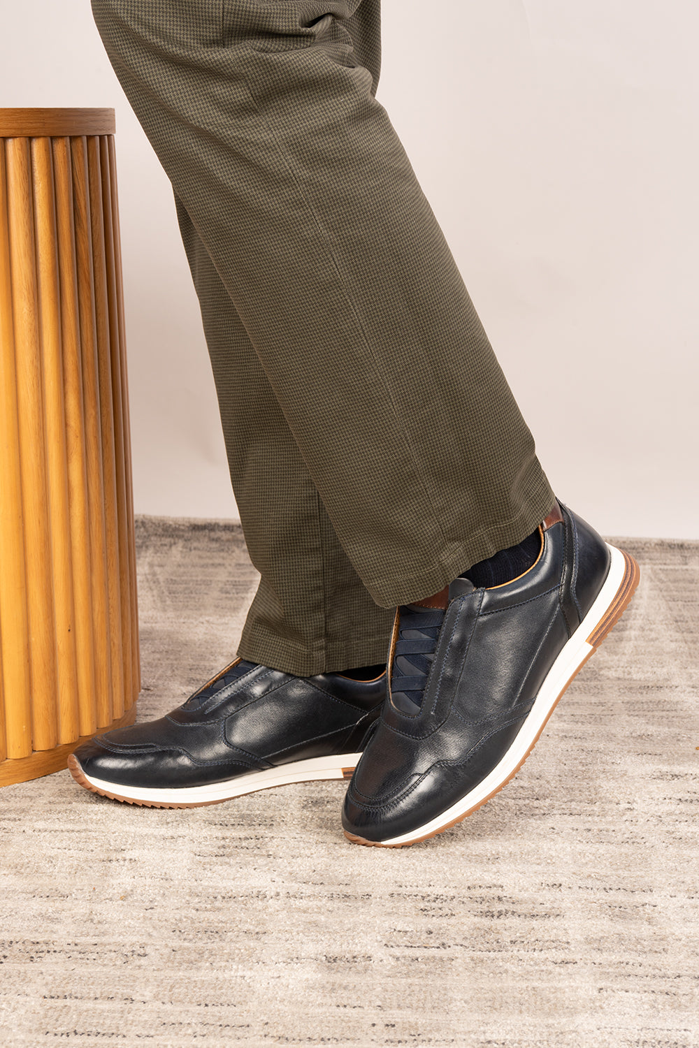 Colt Navy men's leather sneakers, featuring a clever elastic design that ensures a comfortable and secure fit.