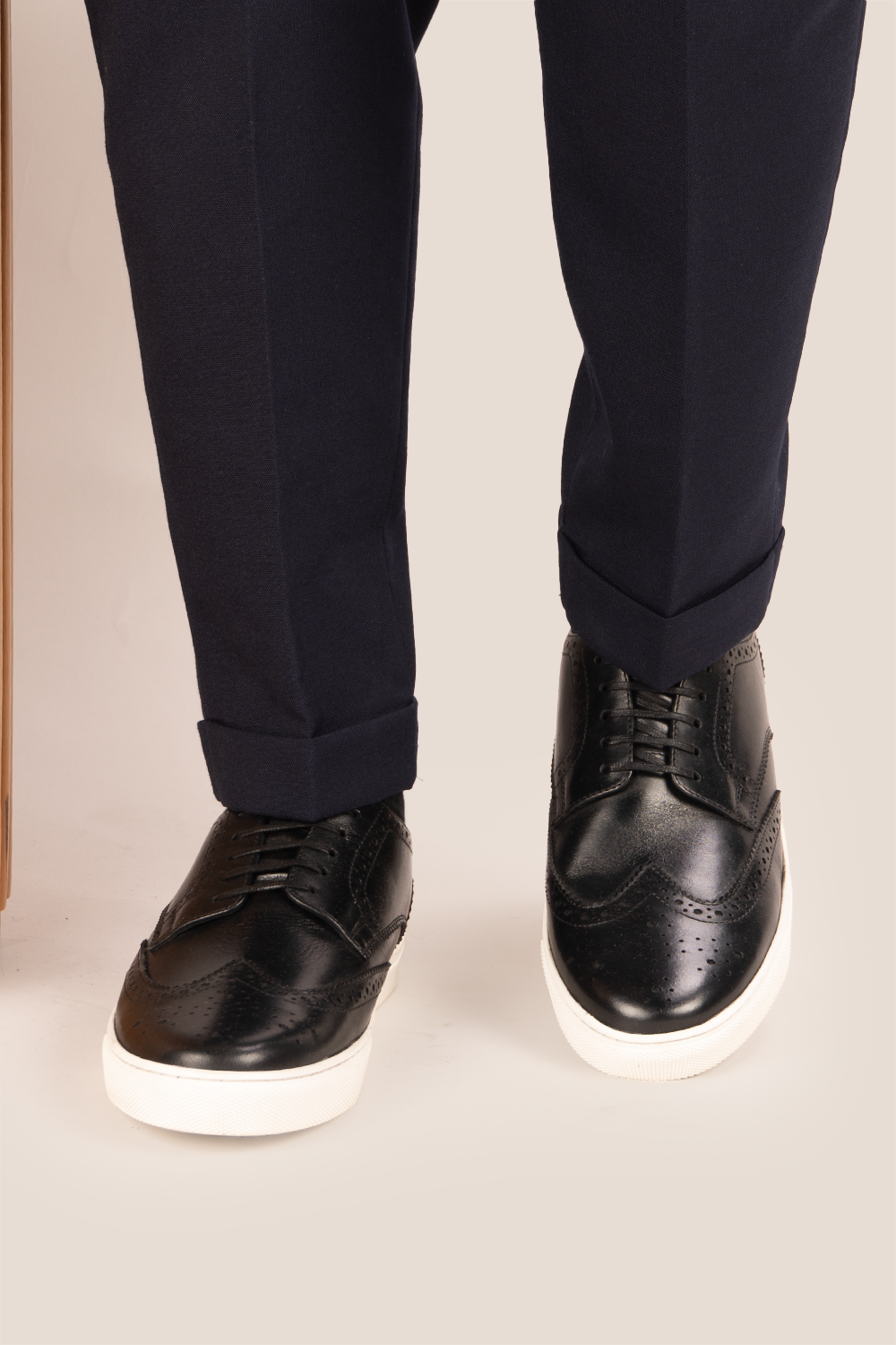 Stan Black wingtip brogue trainer shoes for men, crafted from premium leather with classic wingtip detailing and modern trainer sole.