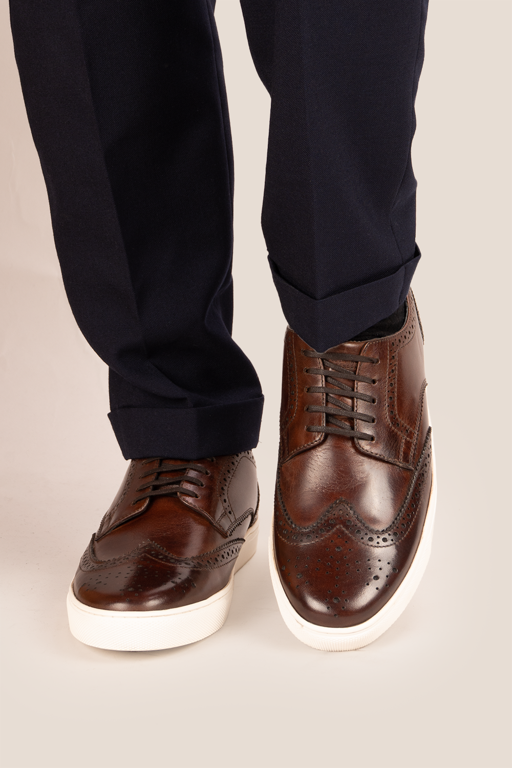 Stan Brown wingtip brogue trainer shoes for men, crafted from premium leather with classic wingtip detailing and modern trainer sole.