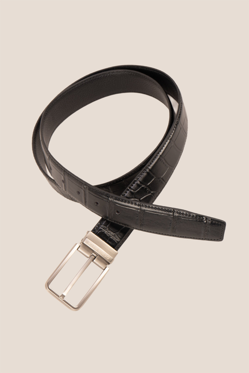 Reggie Black crocodile-embossed leather men’s belt with a classic pin buckle, offering a sleek and sophisticated finish to any outfit.