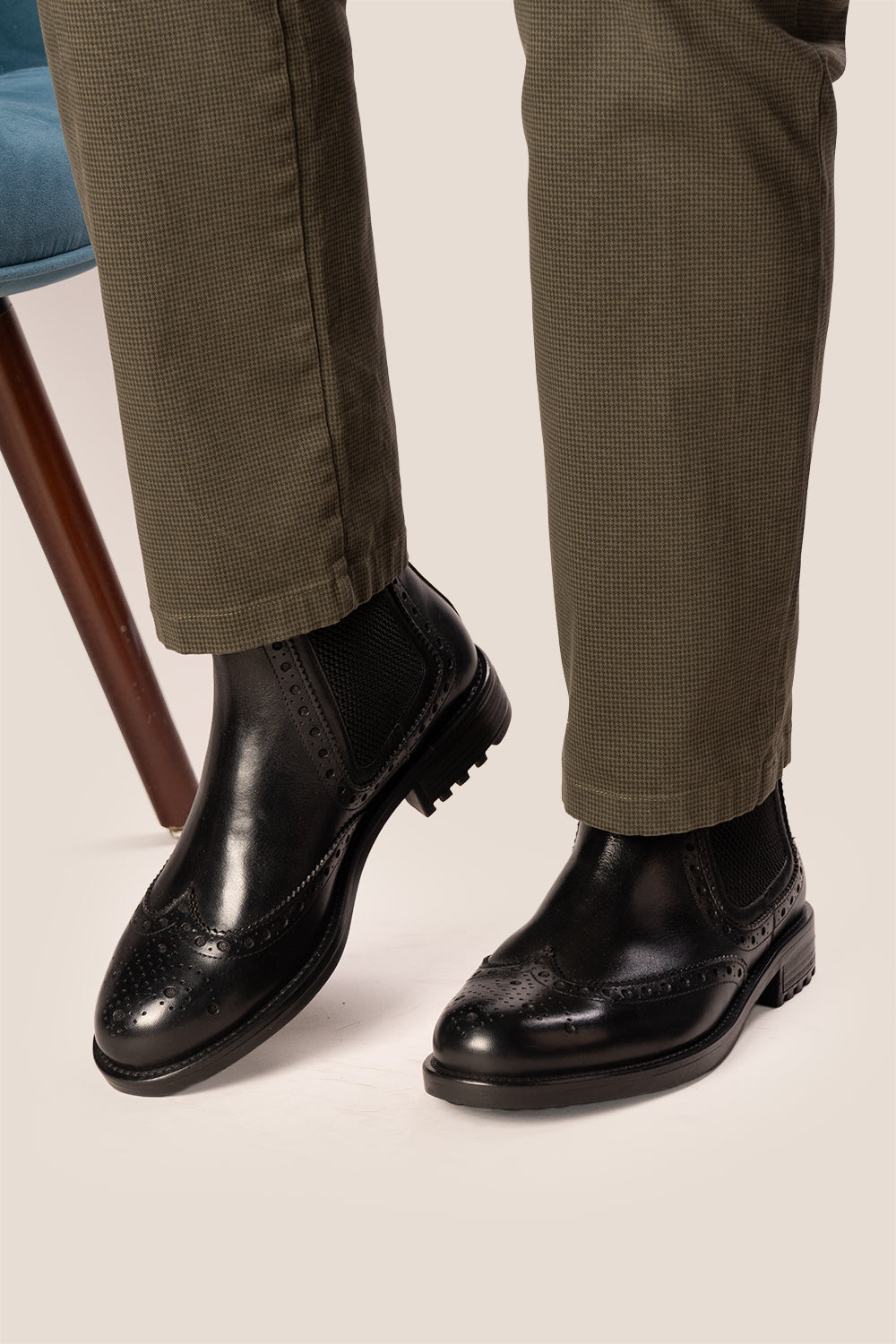Gavin black leather Chelsea boots for men with intricate brogue detailing, showcasing timeless elegance and refined craftsmanship