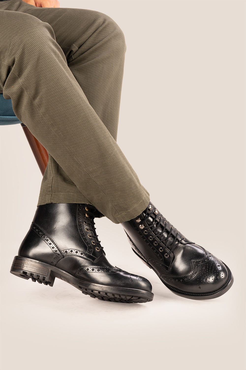 Gregory black leather lace-up boots for men featuring a classic wing cap brogue design with refined stitching and polished finish