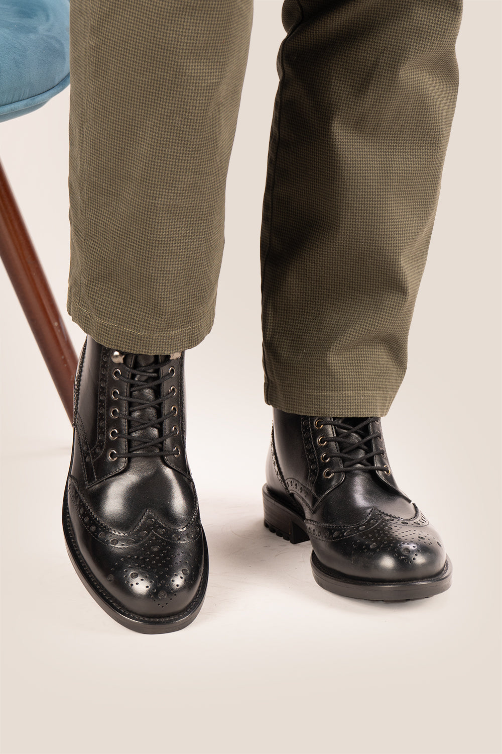 Gregory black leather lace-up boots for men featuring a classic wing cap brogue design with refined stitching and polished finish