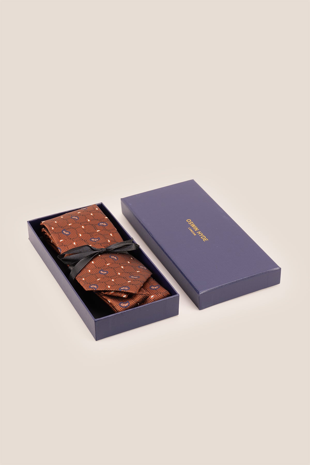 Oswin Hyde Paisley Geometric Bronze tie for men, designed to add a unique touch to your wardrobe. The intricate paisley and geometric patterns, combined with a rich bronze colour.
