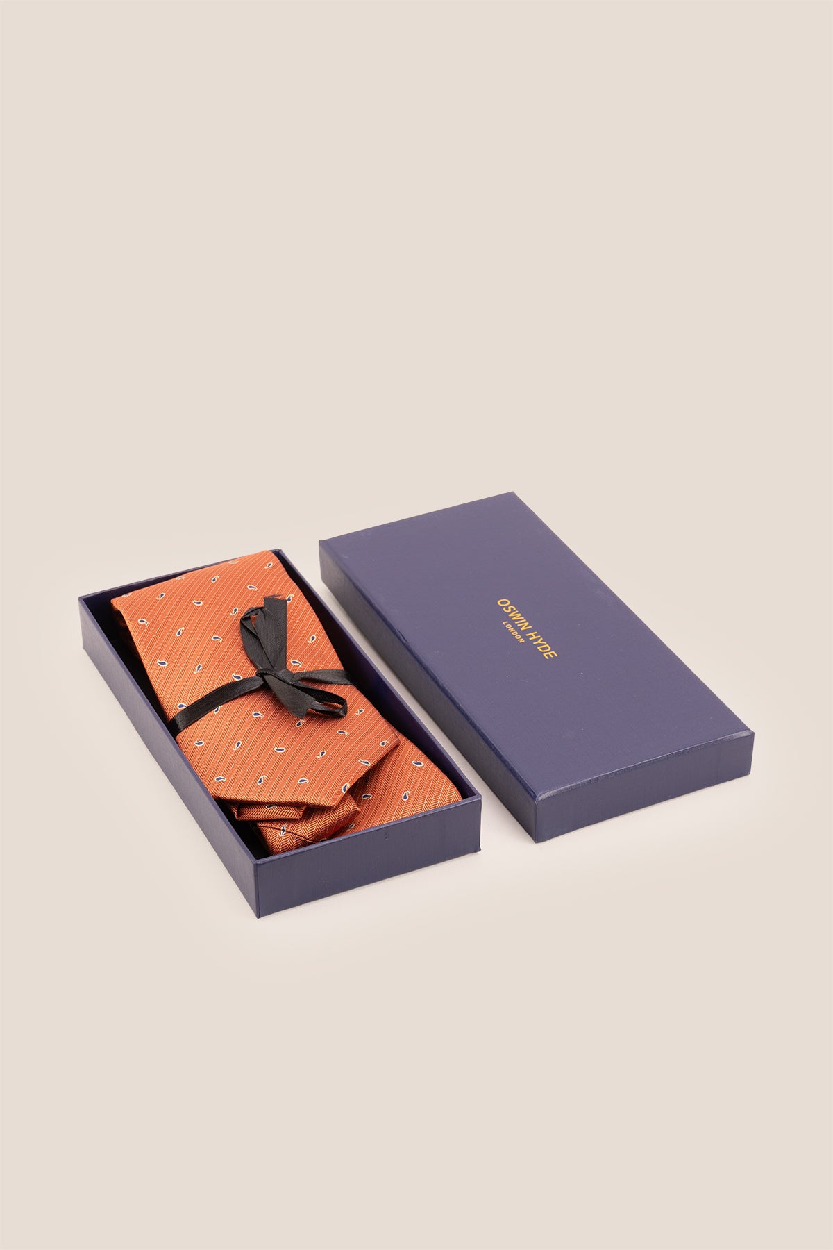 Oswin Hyde Copper Micro Paisley ties for men. The rich copper hue, combined with intricate paisley patterns, crafted from high-quality material