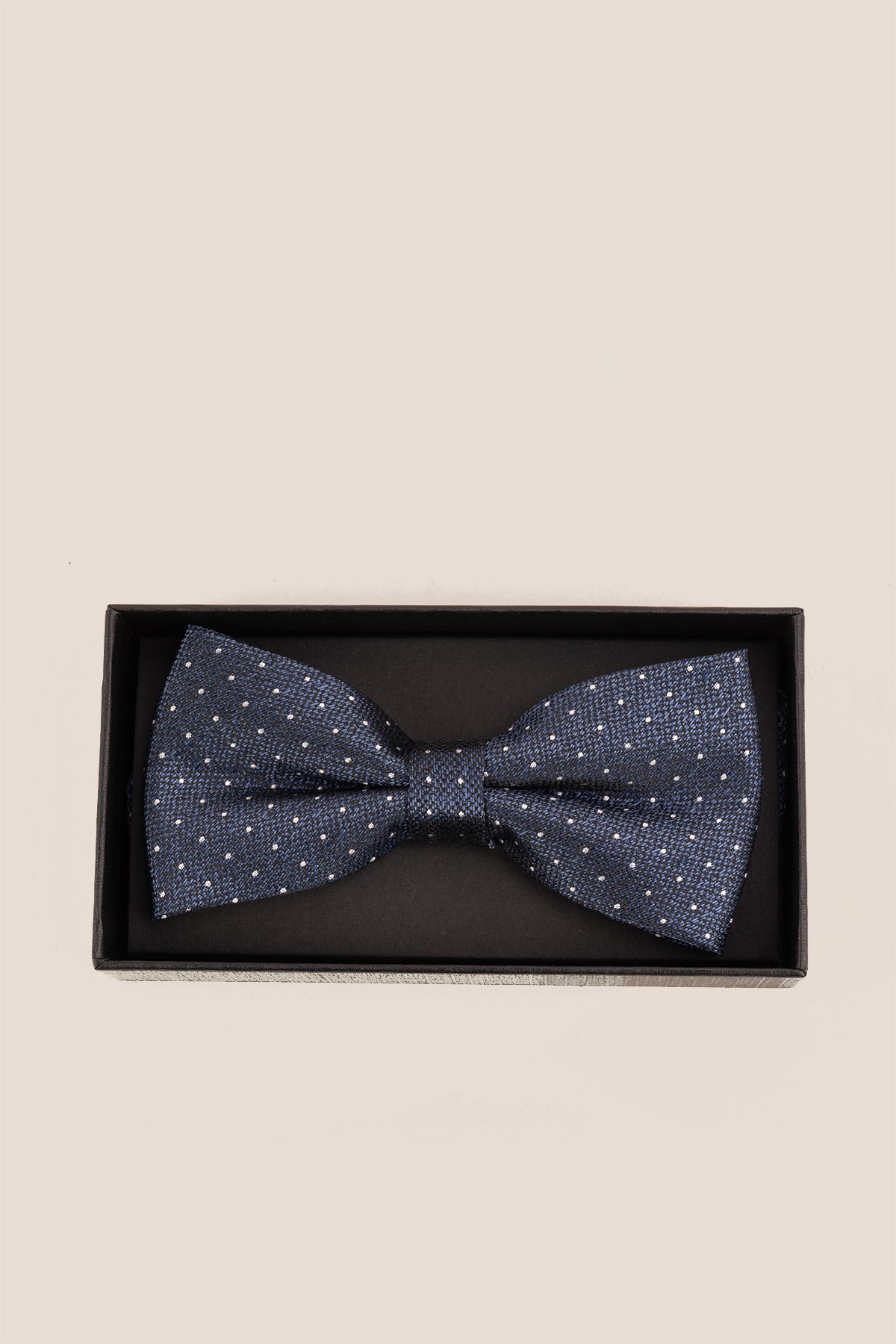 Oswin Hyde Polka Navy Bowtie. Featuring a timeless polka dot design on a rich navy background