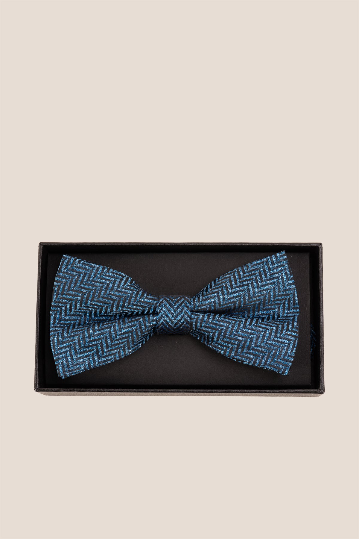 Oswin Hyde Herringbone Blue Bowtie, featuring a classic herringbone pattern. deep blue hue and textured fabric