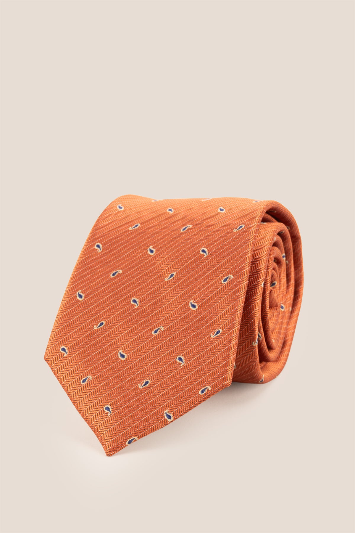 Oswin Hyde Copper Micro Paisley ties for men. The rich copper hue, combined with intricate paisley patterns, crafted from high-quality material