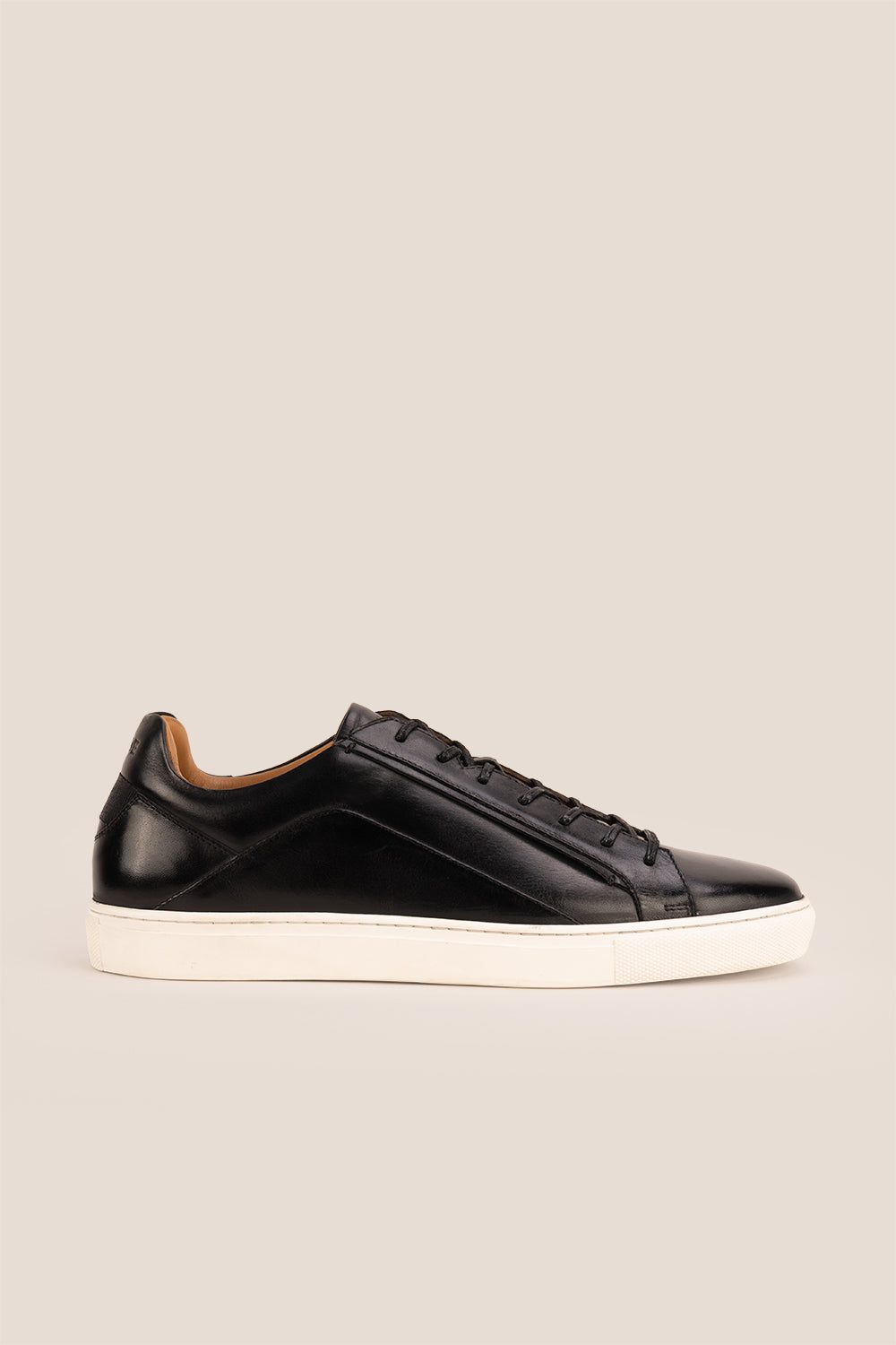 Hayes Black leather sneakers for men, featuring a classic seven-eyelet design that brings a touch of sophistication to your casual wardrobe. Made from premium leather