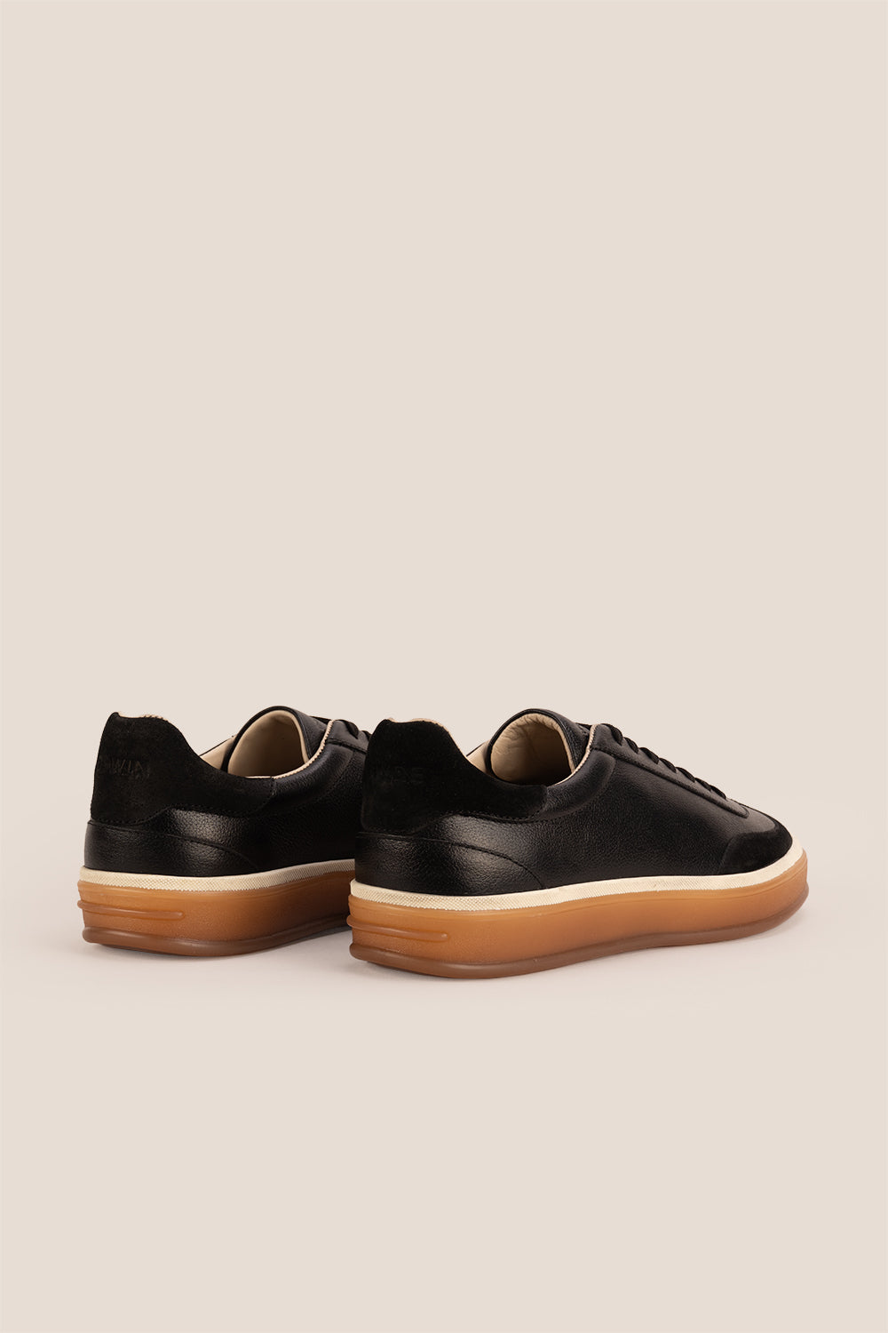 Smith Black leather sneakers for men, featuring a sleek seven-eyelet design that exudes modern elegance. Crafted from premium leather
