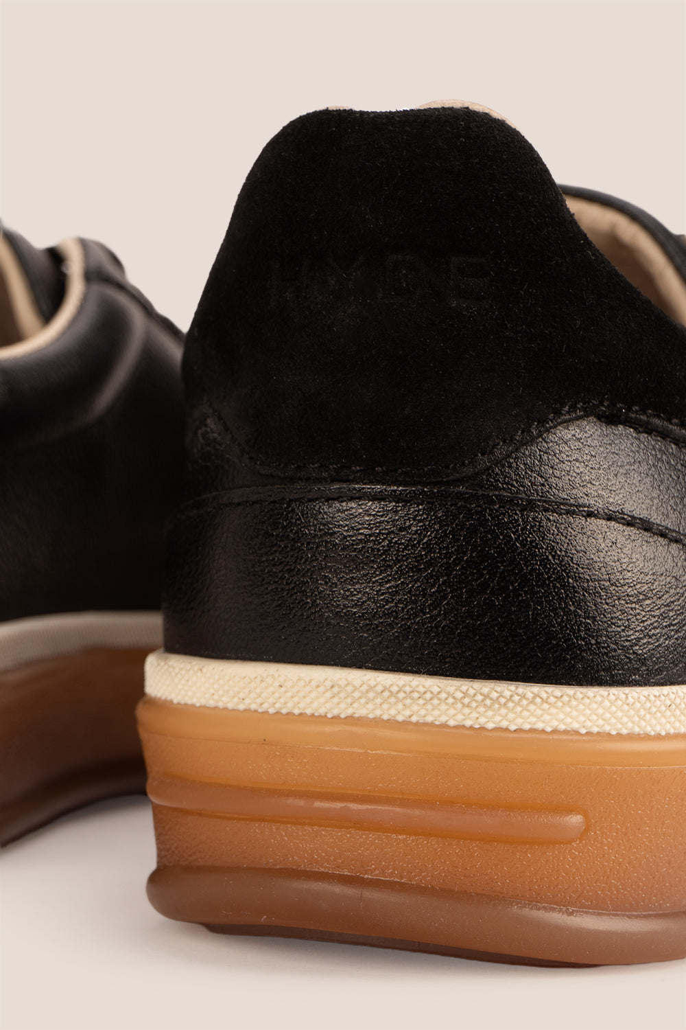 Smith Black leather sneakers for men, featuring a sleek seven-eyelet design that exudes modern elegance. Crafted from premium leather