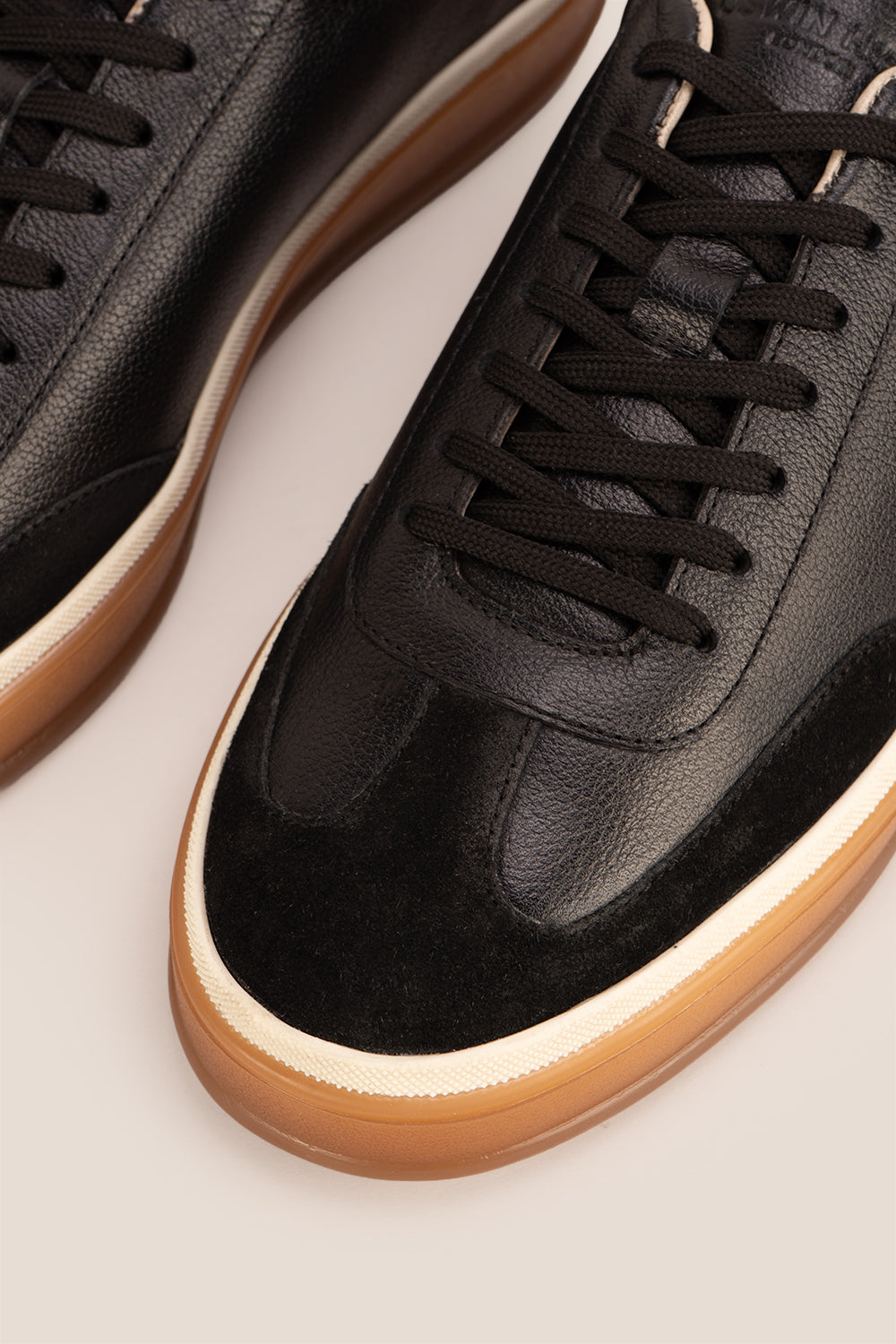 Smith Black leather sneakers for men, featuring a sleek seven-eyelet design that exudes modern elegance. Crafted from premium leather