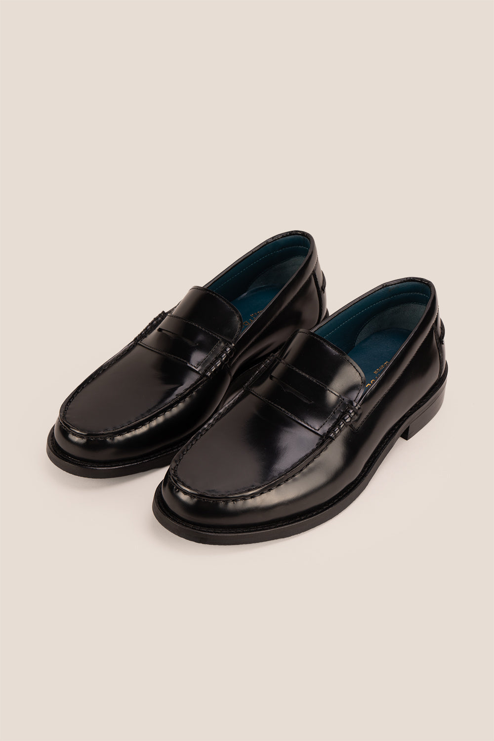 Oswin Hyde Peter Black leather penny loafers for men, crafted to deliver a classic and refined style. Constructed from premium leather
