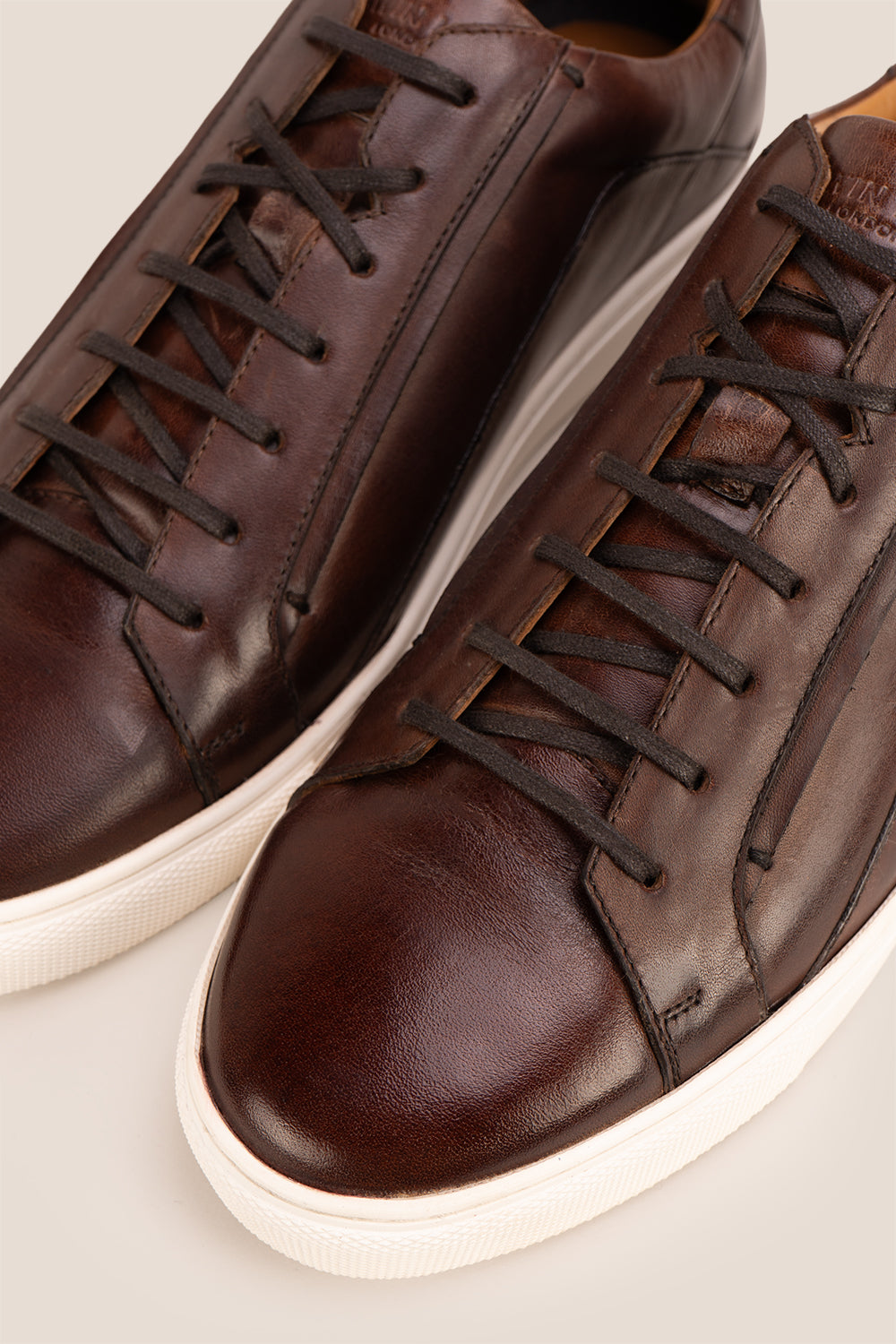 Hayes Brown leather sneakers for men, designed with a classic seven-eyelet style that enhances your everyday attire. Made from premium leather