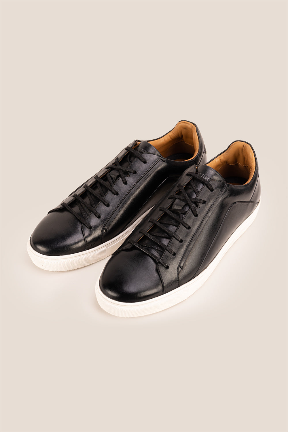 Hayes Black leather sneakers for men, featuring a classic seven-eyelet design that brings a touch of sophistication to your casual wardrobe. Made from premium leather