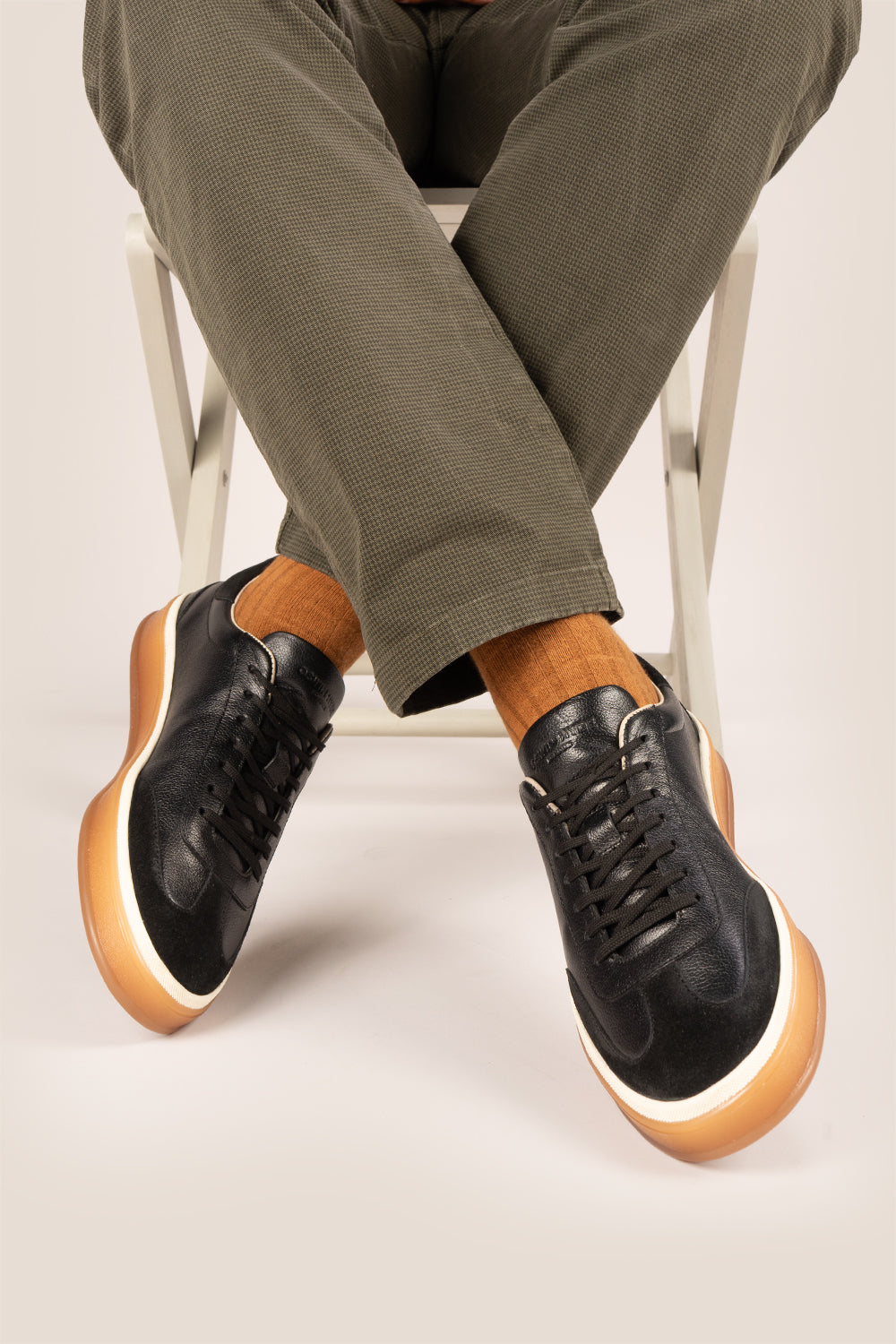 Smith Black leather sneakers for men, featuring a sleek seven-eyelet design that exudes modern elegance. Crafted from premium leather