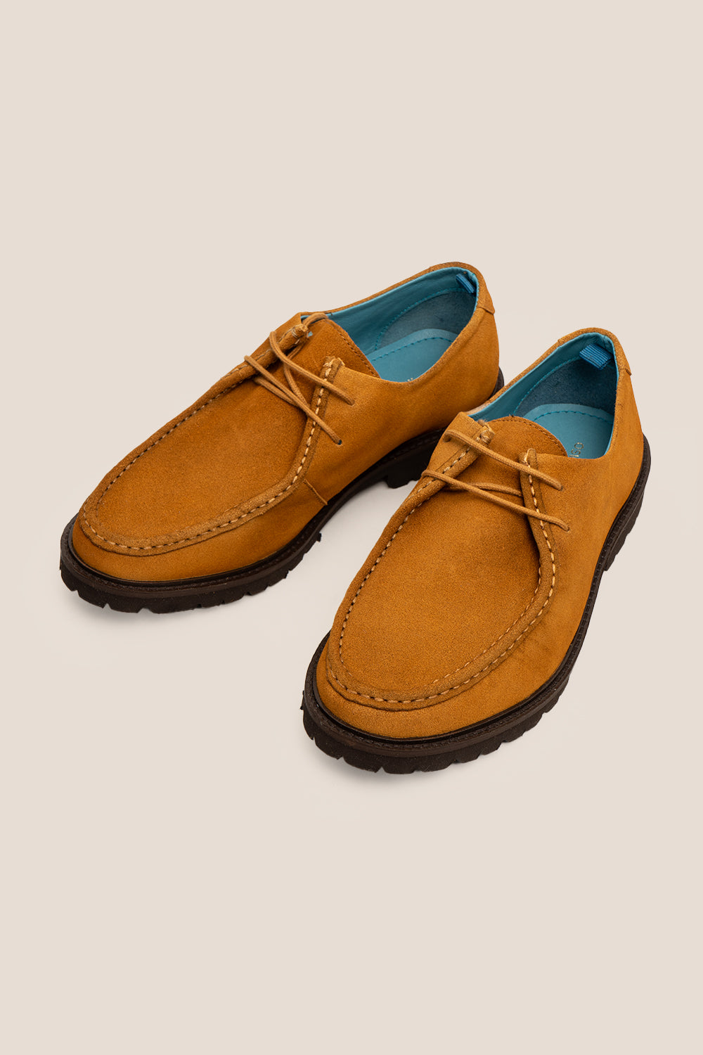 Men’s Joshua tobacco suede Wallabee shoes with moccasin stitching, natural crepe sole and relaxed smart-casual design.