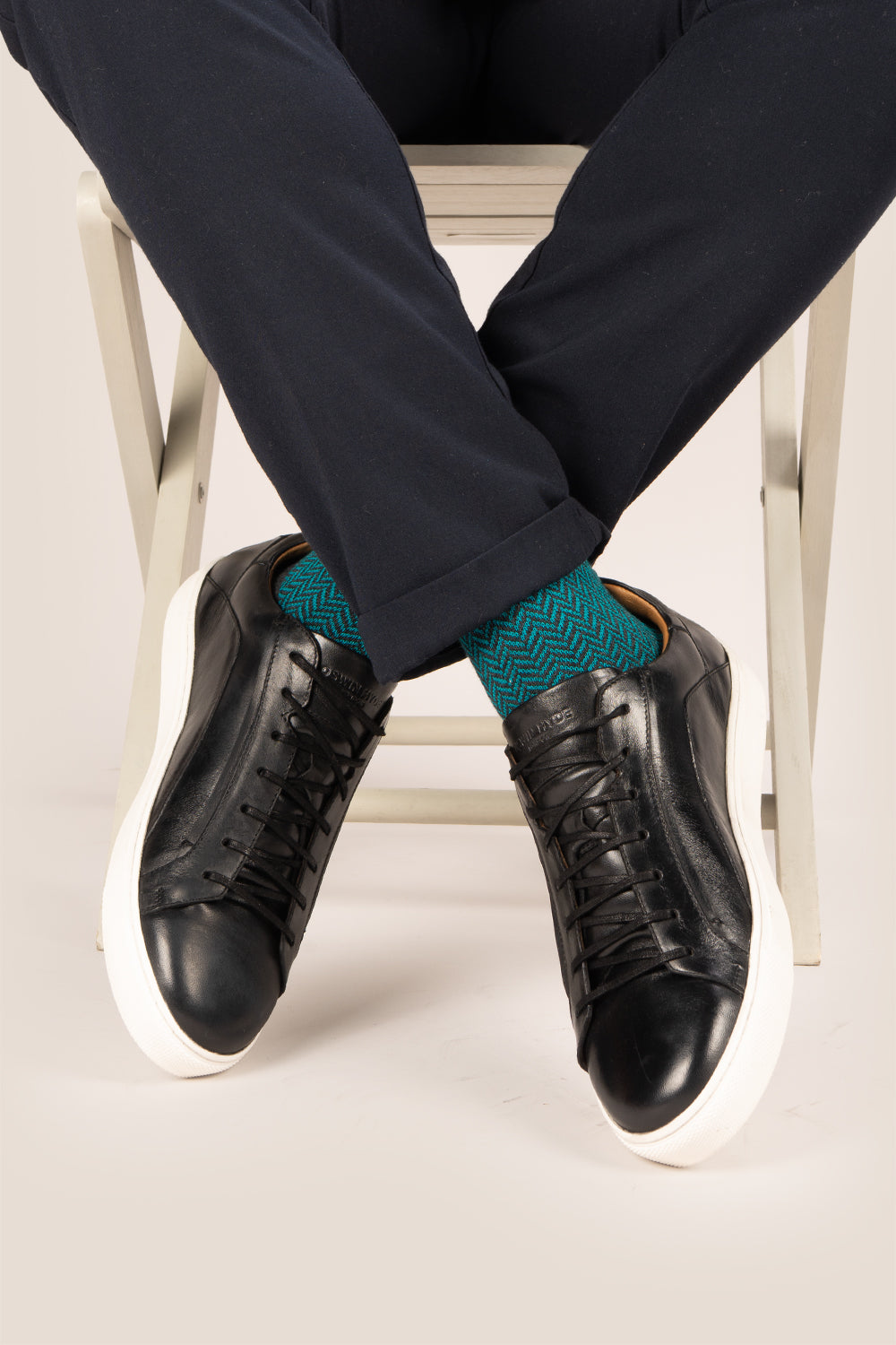 Hayes Black leather sneakers for men, featuring a classic seven-eyelet design that brings a touch of sophistication to your casual wardrobe. Made from premium leather