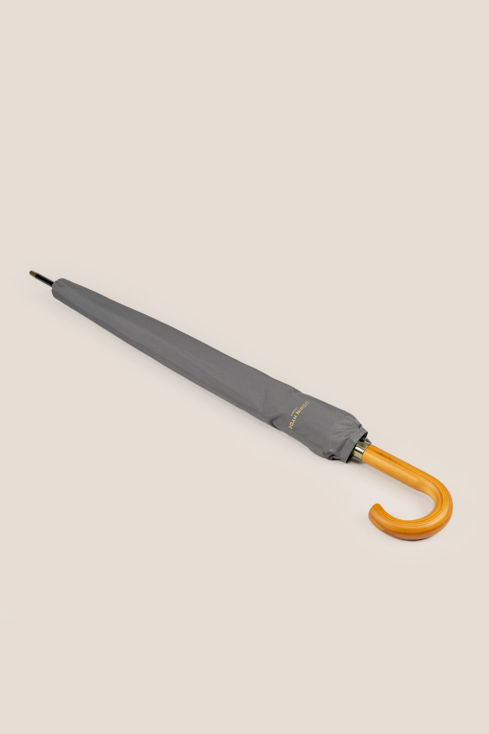 Joseph Grey men’s windproof umbrella with wooden J-handle, blending classic design with reliable durability for refined all-weather protection.