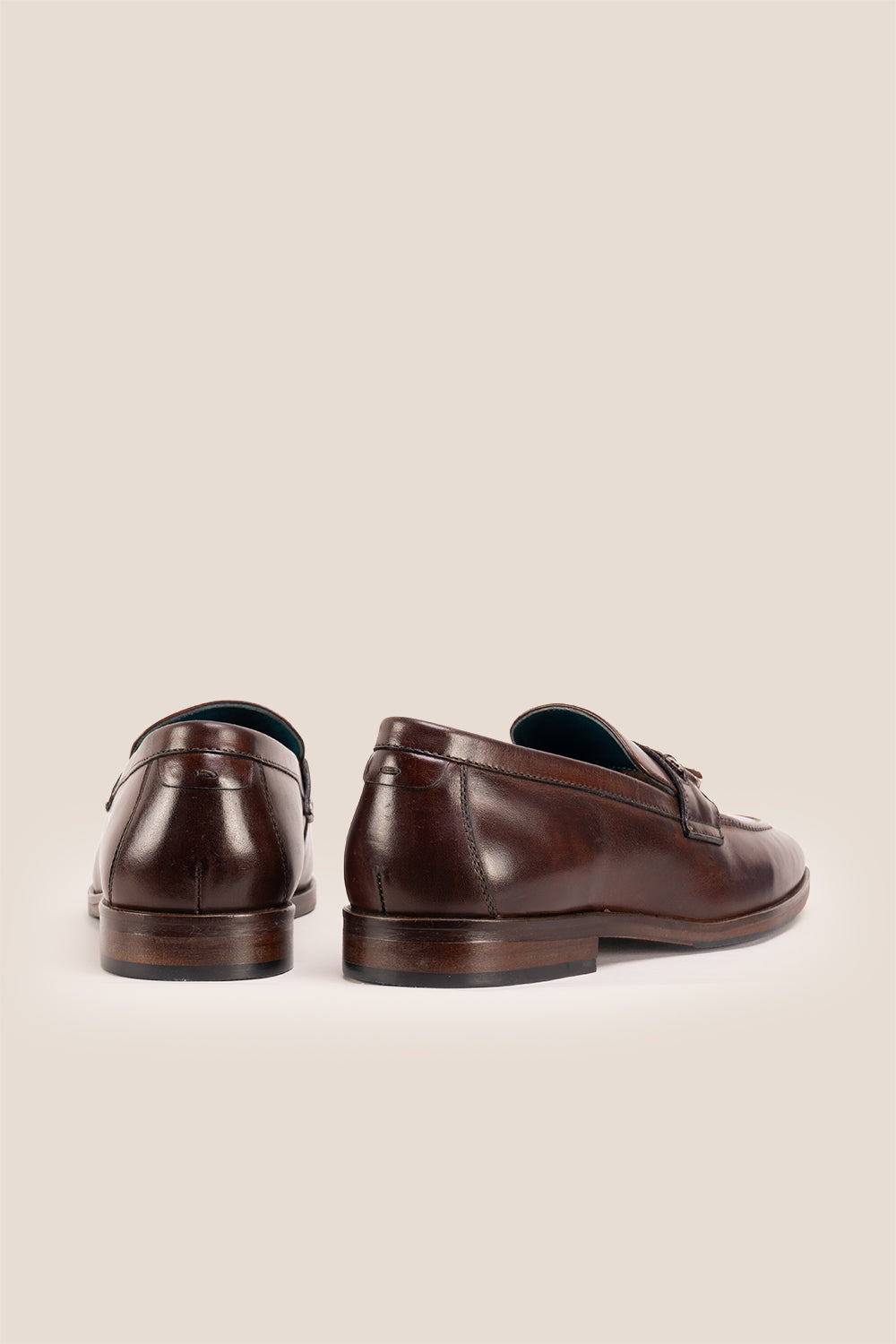 Emmet Brown loafers, crafted from luxurious leather and adorned with refined metal accents