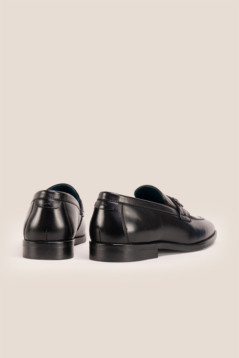 Emmet black leather loafers for men with trim and tassel detail, crafted from premium leather for refined casual and formal wear.