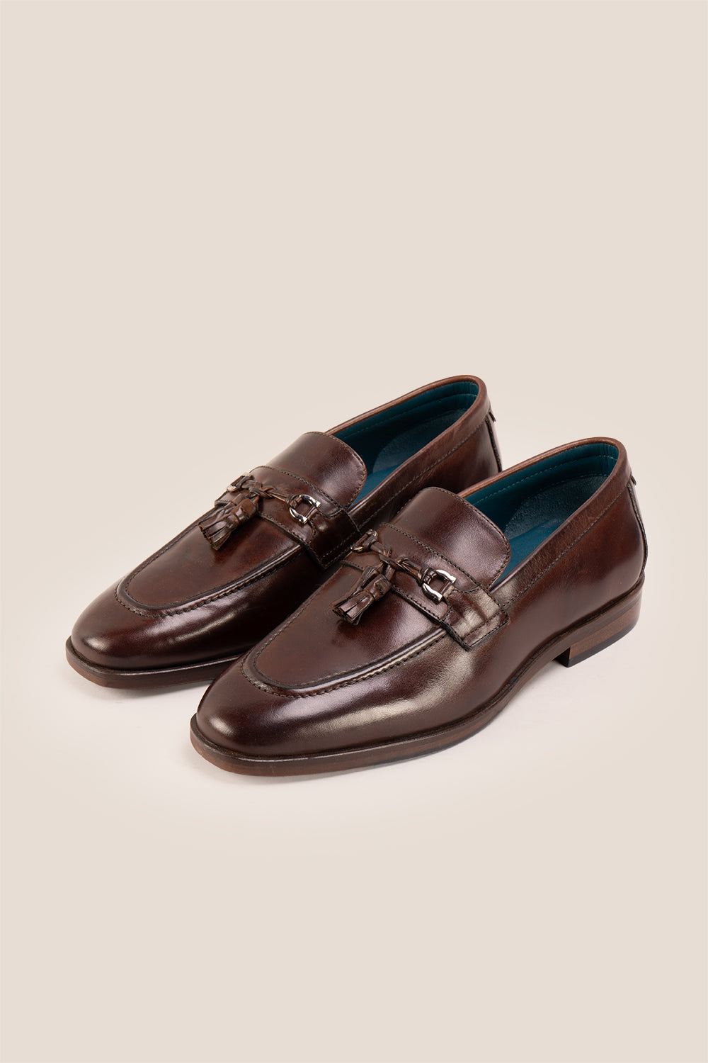 Emmet Brown loafers, crafted from luxurious leather and adorned with refined metal accents