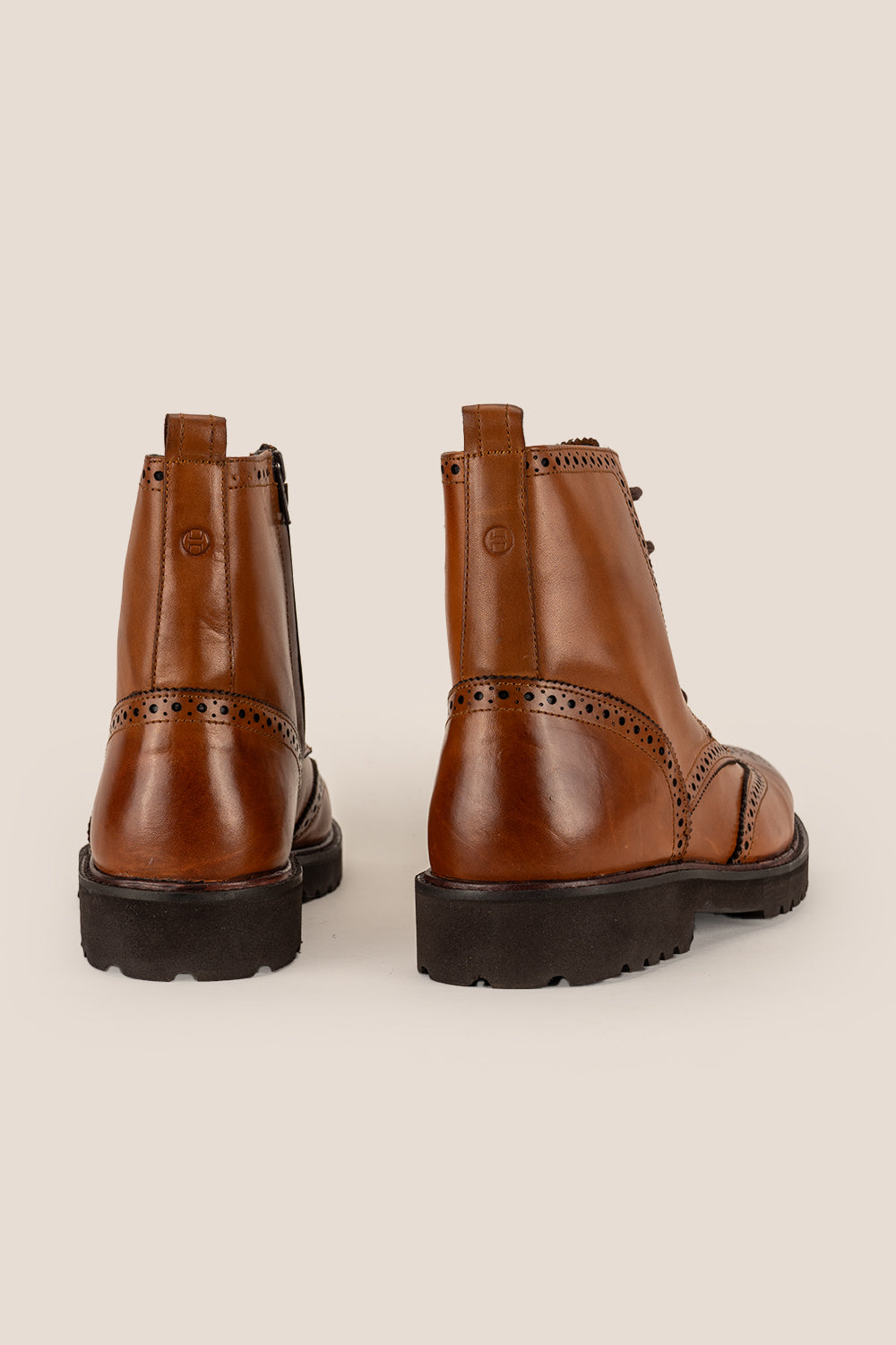 Graham tan leather brogue boots for men with classic perforated detailing, ideal for dressy and smart-casual occasions.