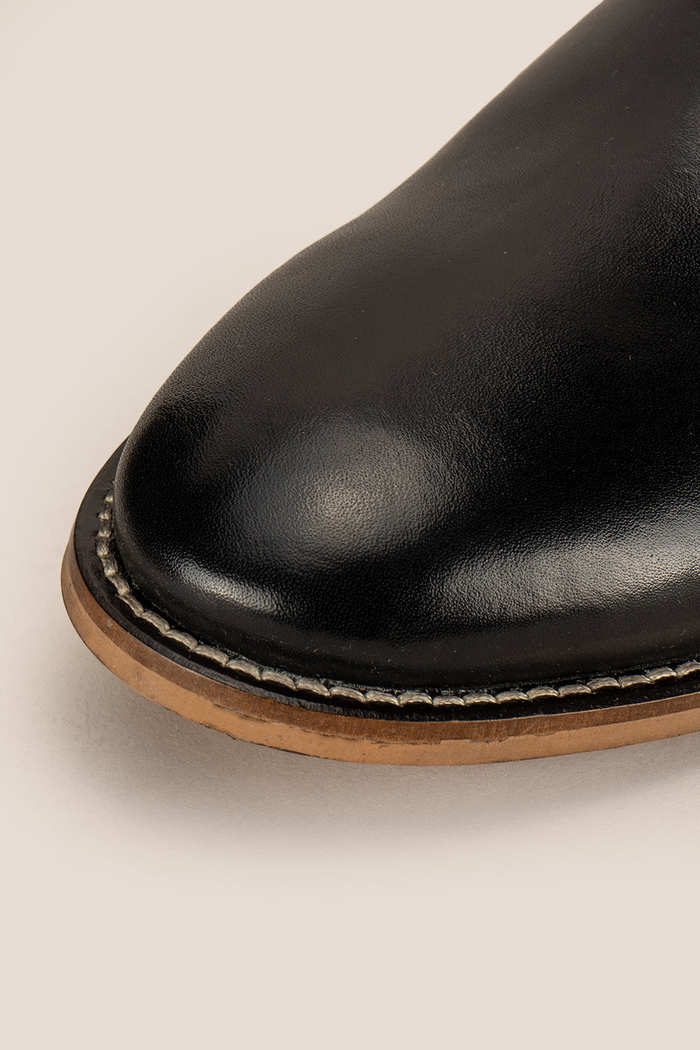 Dennis black leather Chelsea boots for men by Oswin Hyde – luxury slip-on boots with sleek silhouette, elastic sides, and premium formal styling.
