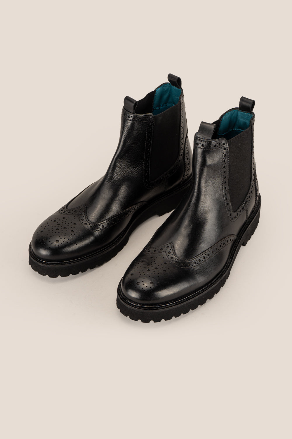 Grant Black men’s leather brogue Chelsea boots featuring a chunky sole, lightweight design, and comfortable fit for versatile smart-casual style.