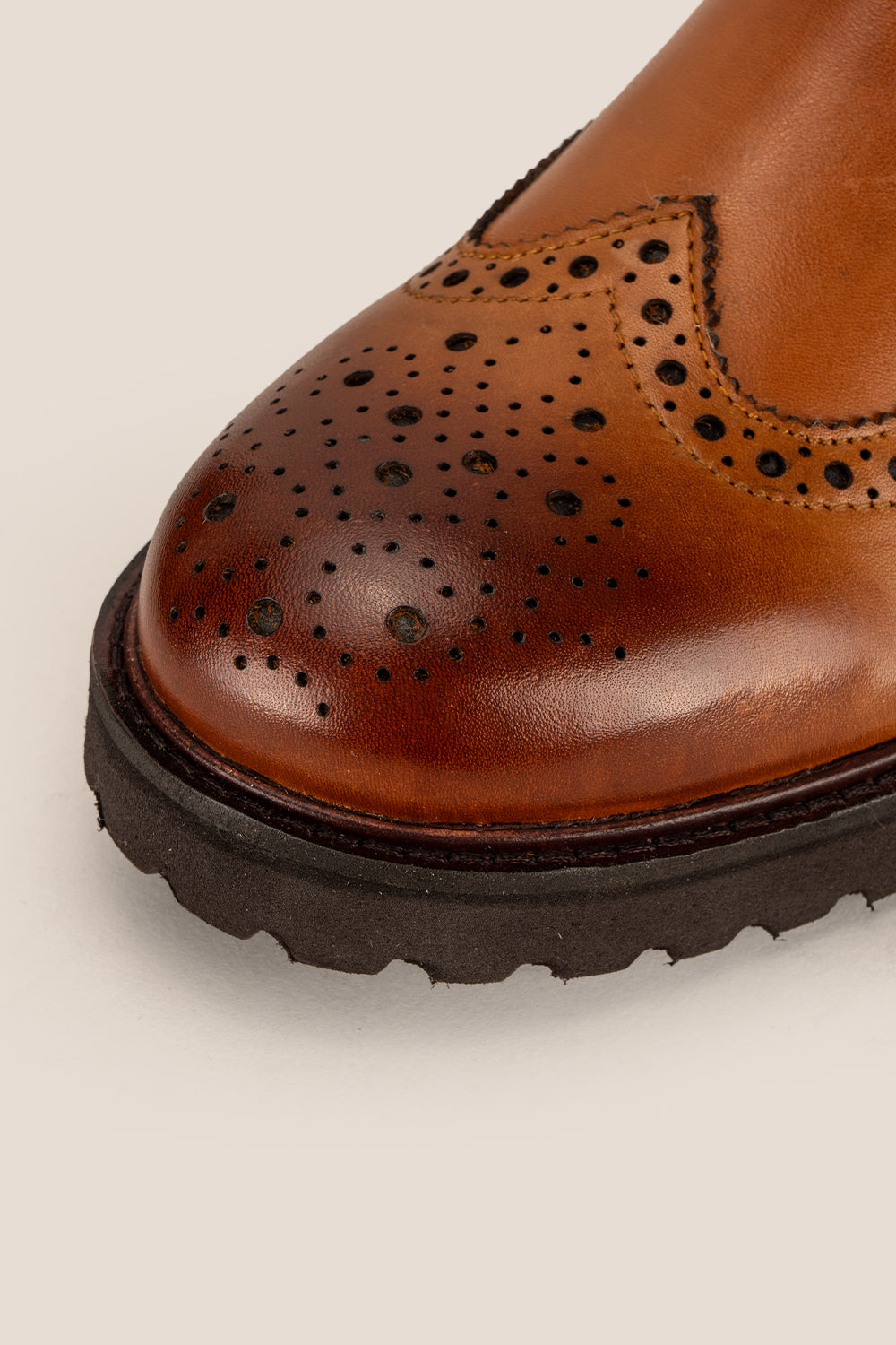 Grant Tan men’s leather brogue Chelsea boots featuring a chunky sole, lightweight design, and comfortable fit for smart casual occasions.