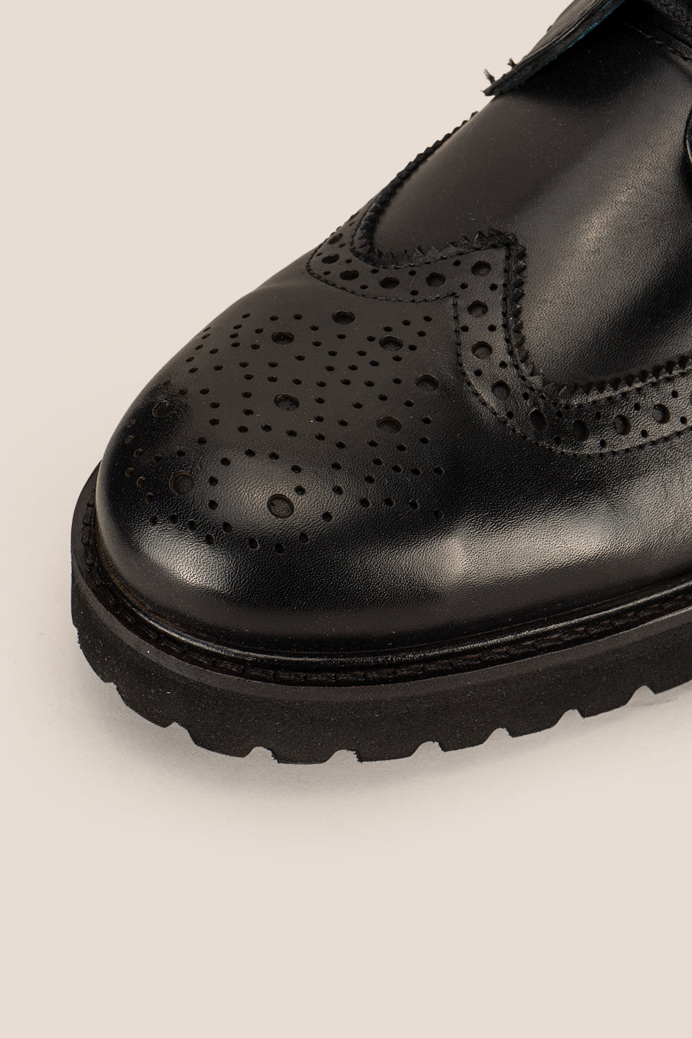 Black leather lace-up brogue boots for men by Oswin Hyde – comfortable, durable boots with wingtip detailing and cushioned insoles for everyday style.