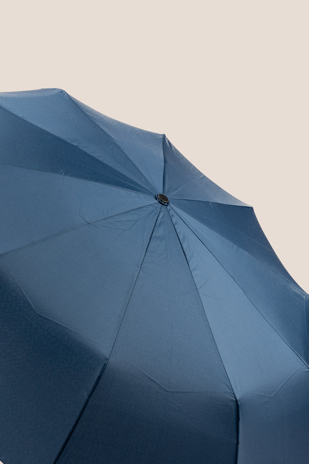 Paul Navy windproof compact travel umbrella featuring a folding design and comfortable grip for stylish, secure protection against the elements.