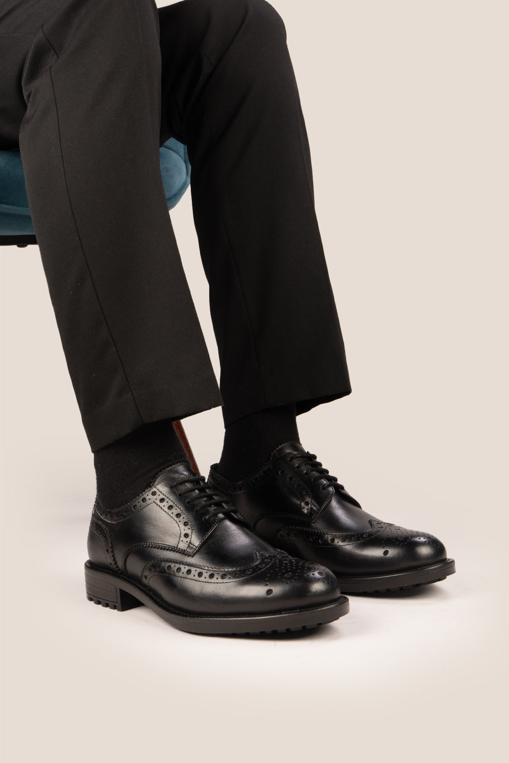 George Black leather shoes for men. Featuring a five-eyelet wing cap brogue design, these shoes offer timeless style and comfort