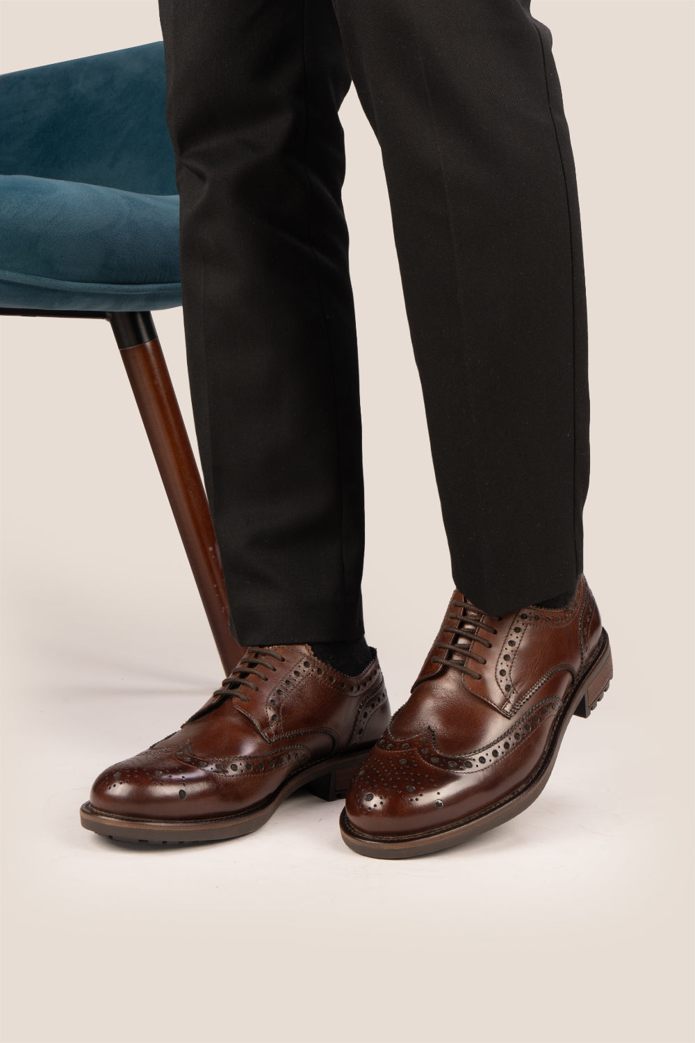 George Brown leather shoes for men. Featuring a five-eyelet wing cap brogue design, these shoes offer timeless style and comfort