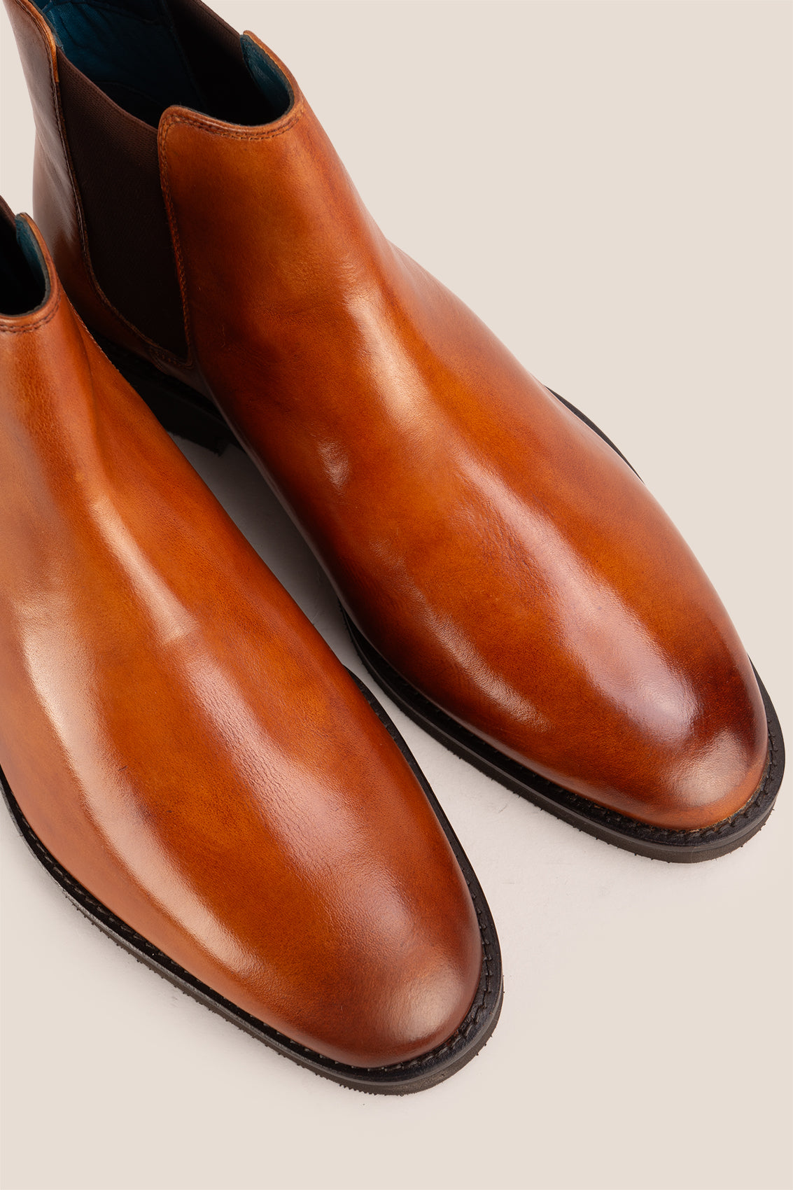Michael tan leather Chelsea boots for men with elastic sides and pull tab, perfect for smart-casual and formal wear.